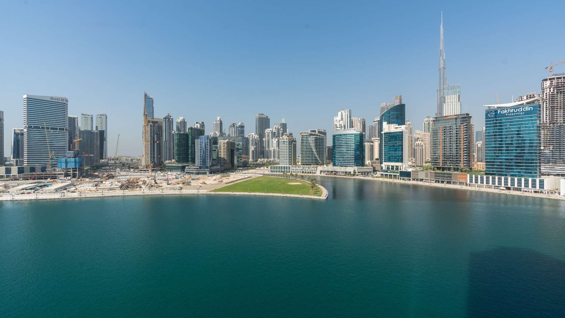 Luxurious penthouse terrace with modern seating and stunning Business Bay water views