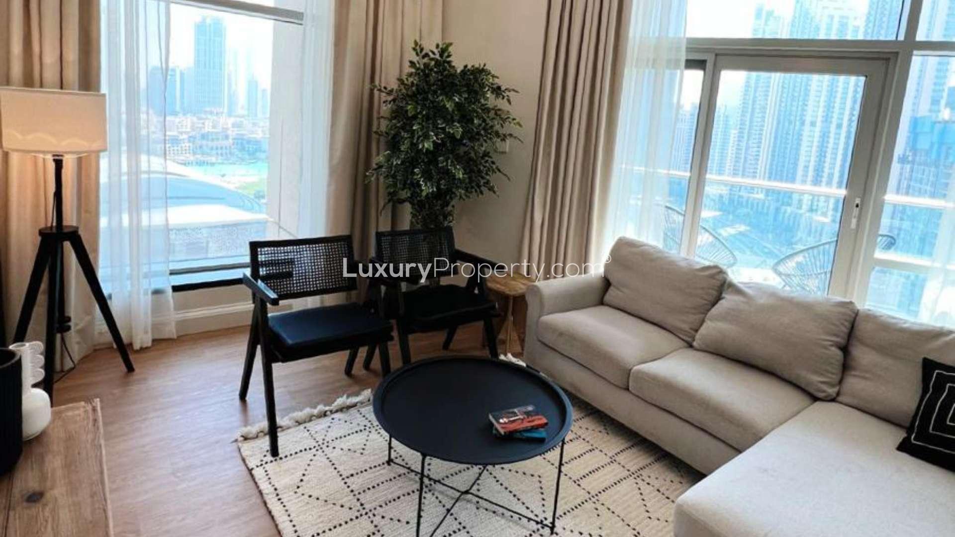Dining area in 2-bed apartment, Burj Residences, Downtown Dubai, with modern decor and artwork