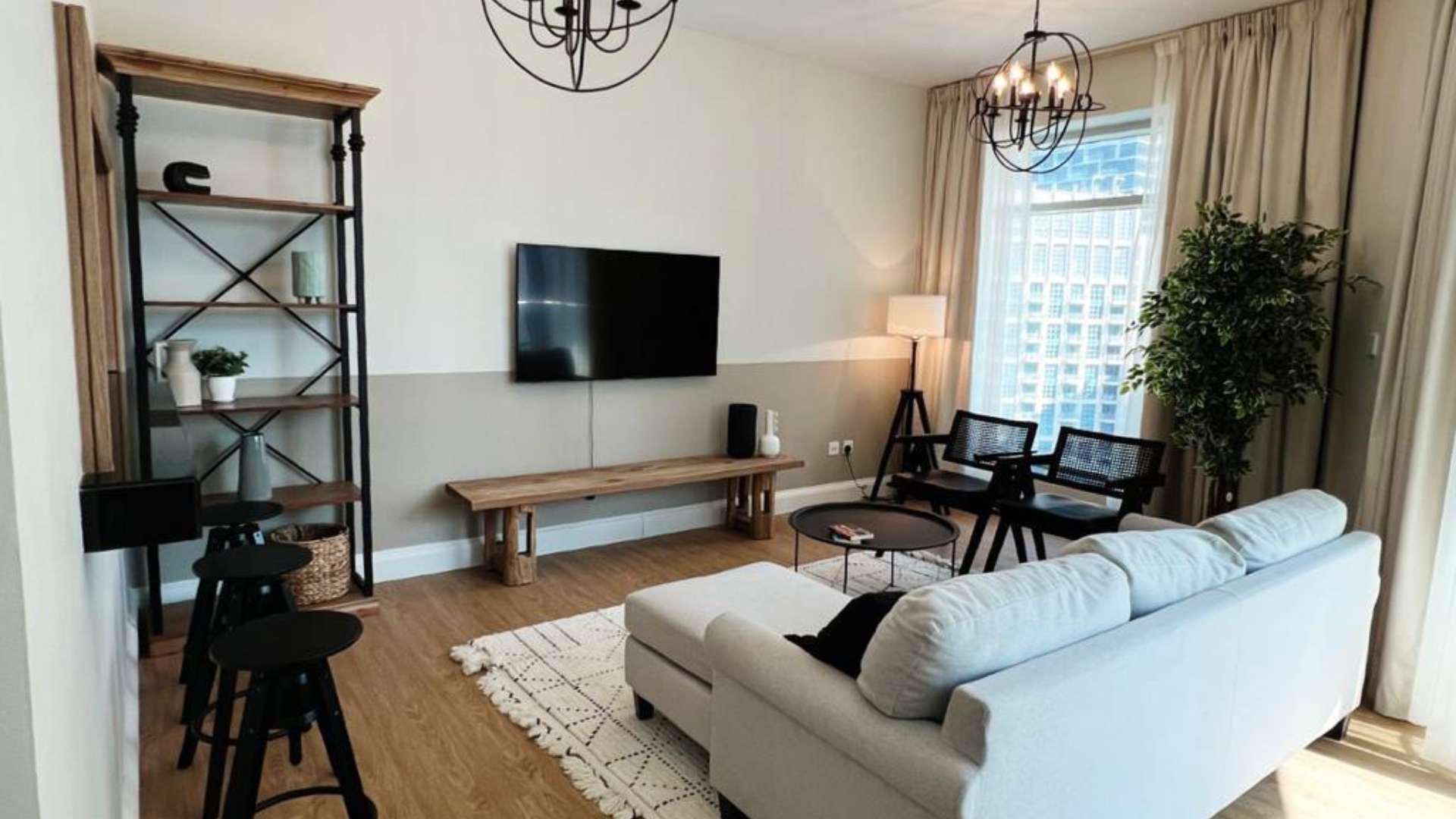 Cozy living room in Downtown Dubai apartment with city and fountain views