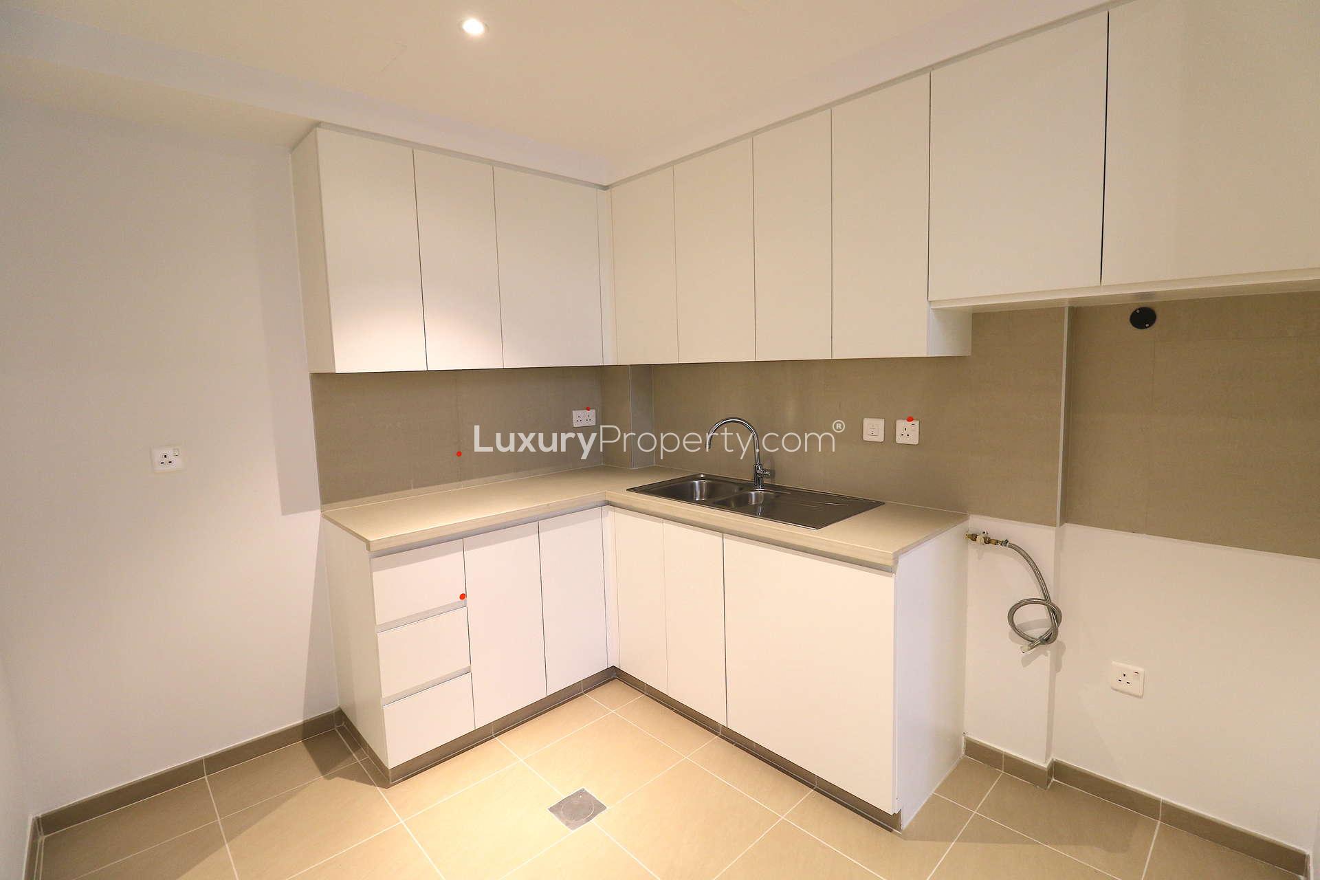 Outdoor pool area at Jenna Apartments, Town Square, showcasing modern residential architecture