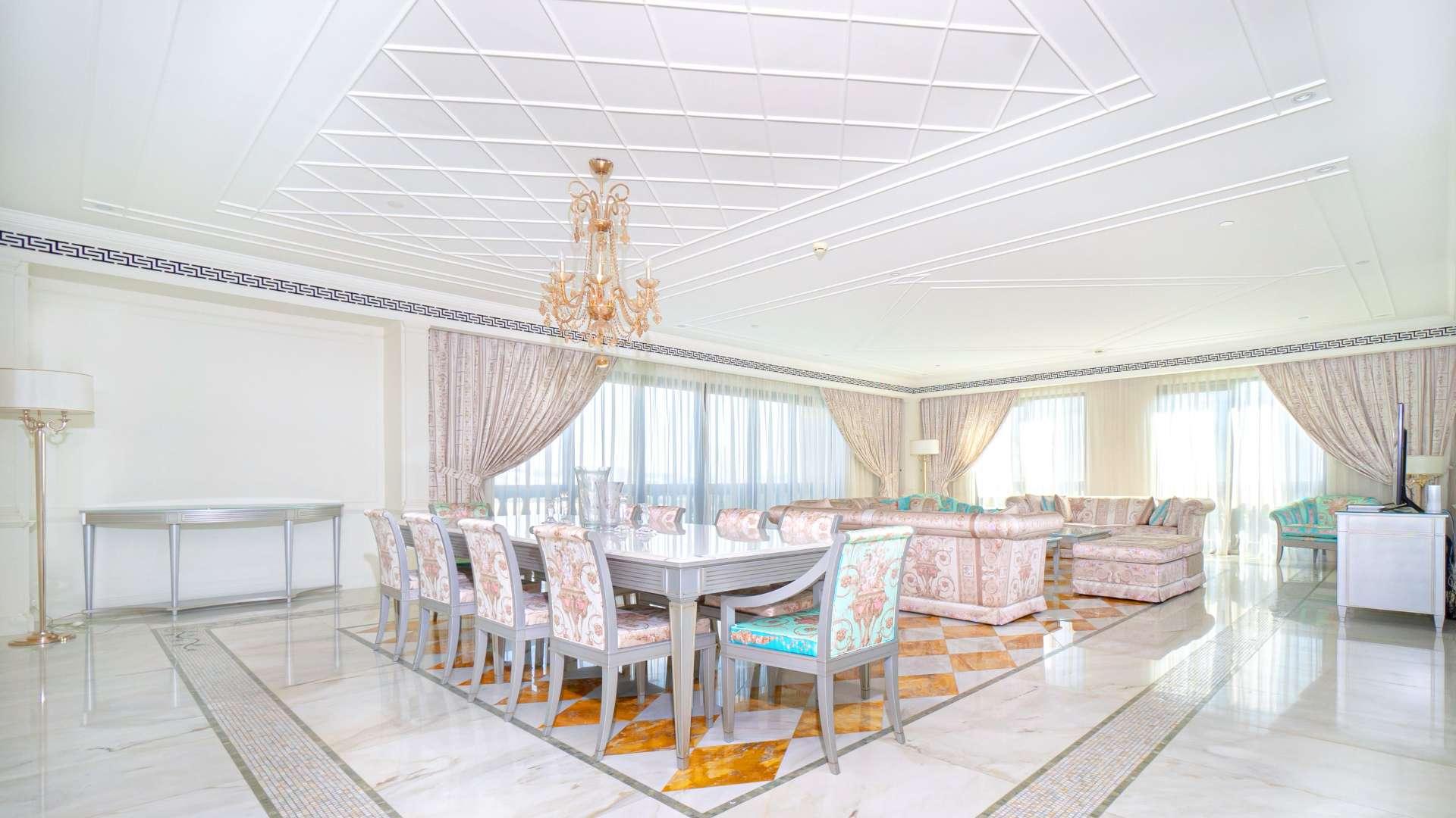 "Palazzo Versace apartment with pool view, water views, and modern architecture in Culture Village.",Luxurious Palazzo Versace apartment with Versace furniture, elegant design, and spacious layout in Culture Village