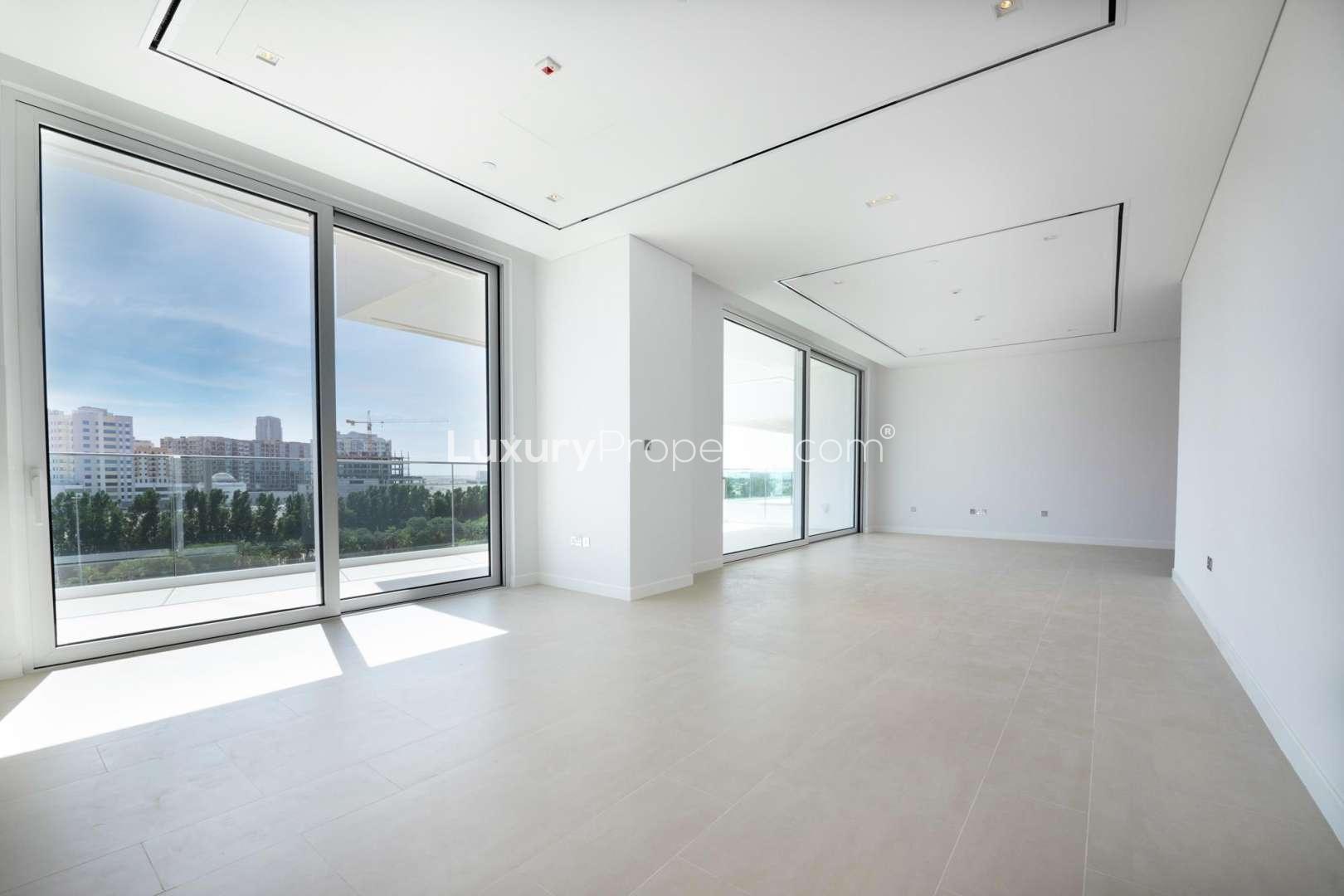 Modern apartment exterior with lush landscaping in Seventh Heaven, Al Barari, available for rent