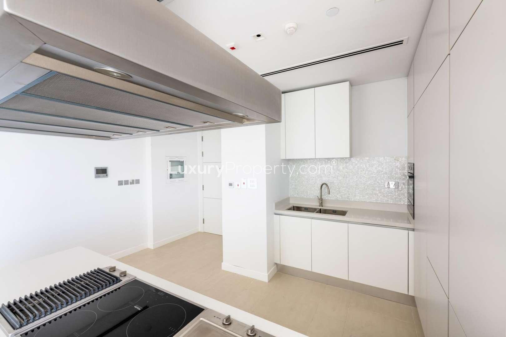 Spacious living area with large windows in Seventh Heaven, Al Barari apartment for rent