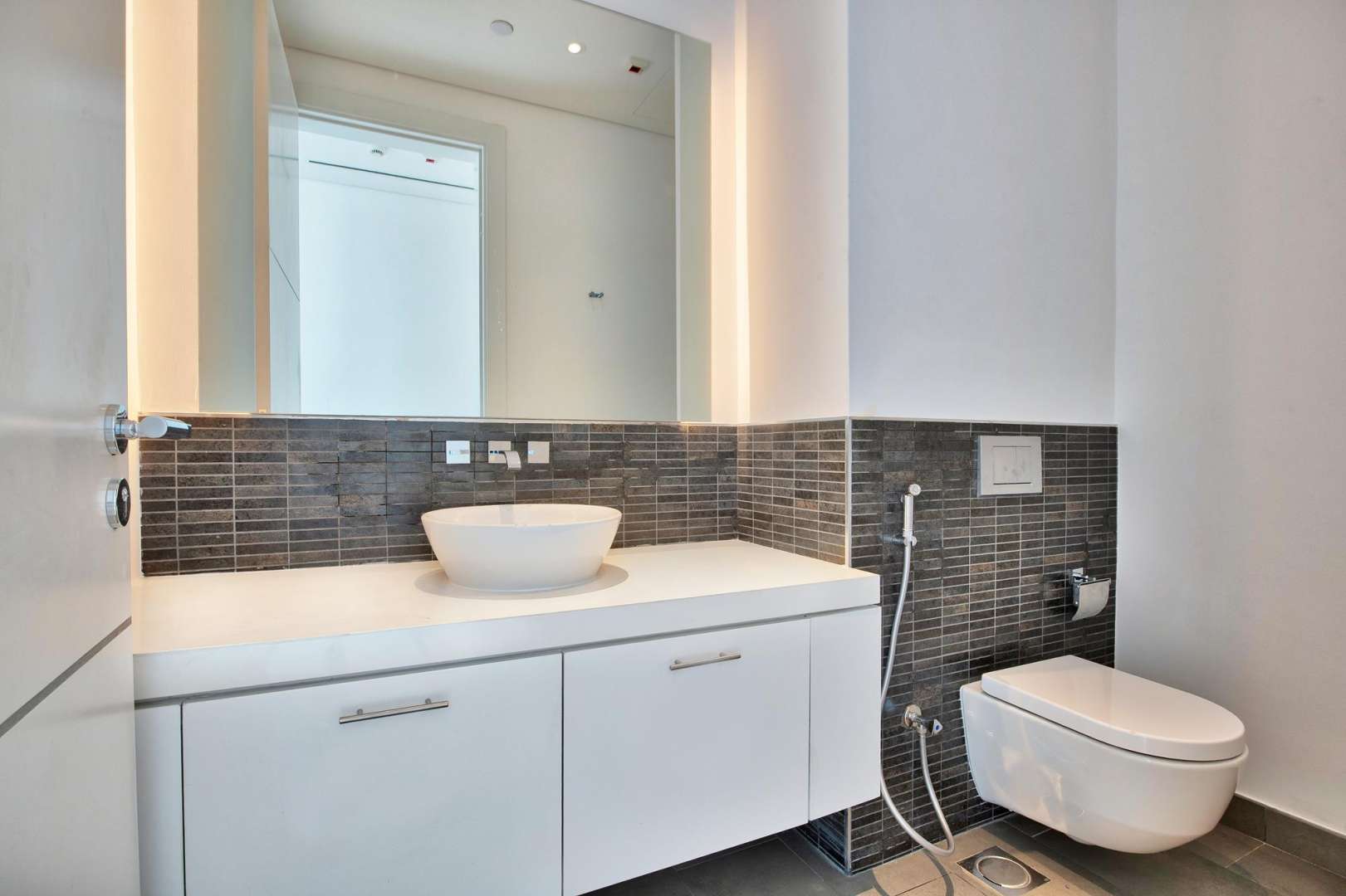 Modern kitchen in 1-bedroom apartment, Seventh Heaven, Al Barari, with sleek countertops and appliances