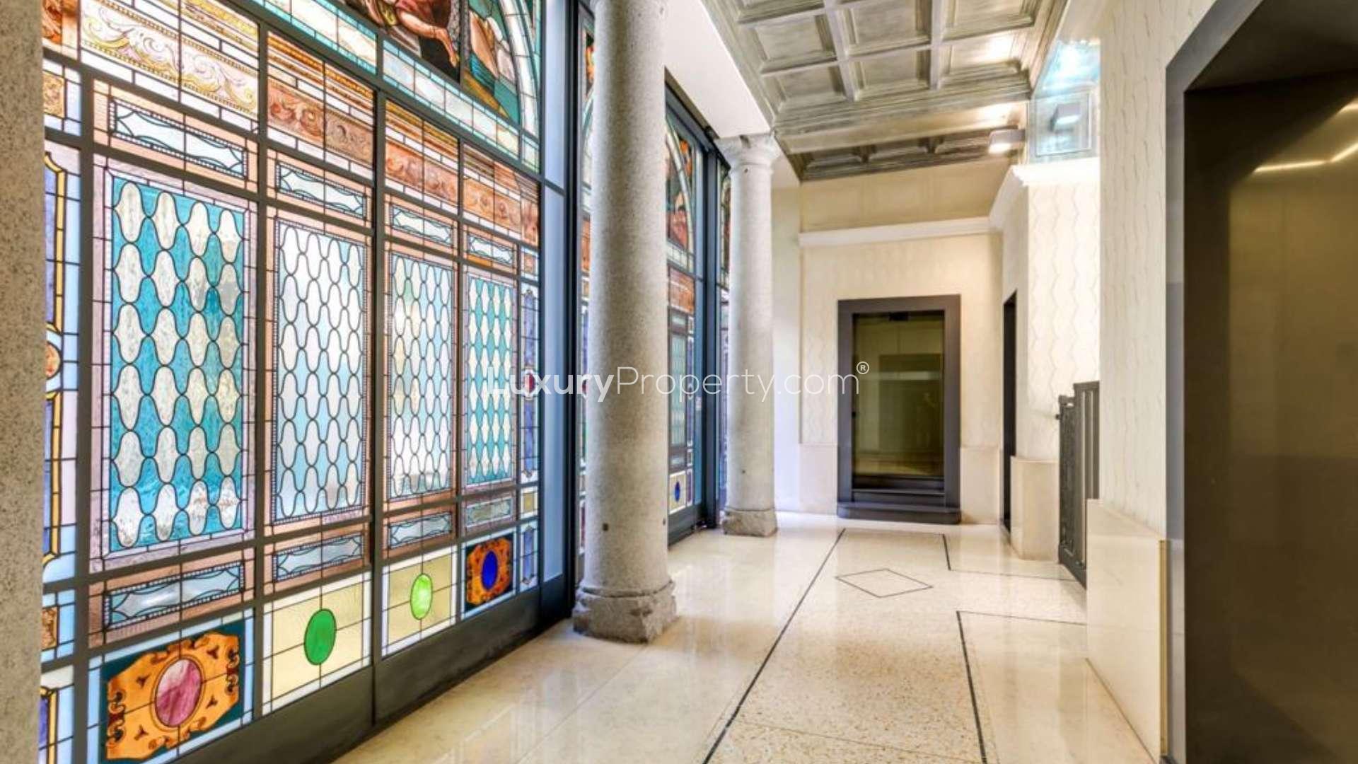Courtyard view of fully renovated loft near Castello Sforzesco, Milan with bicycles