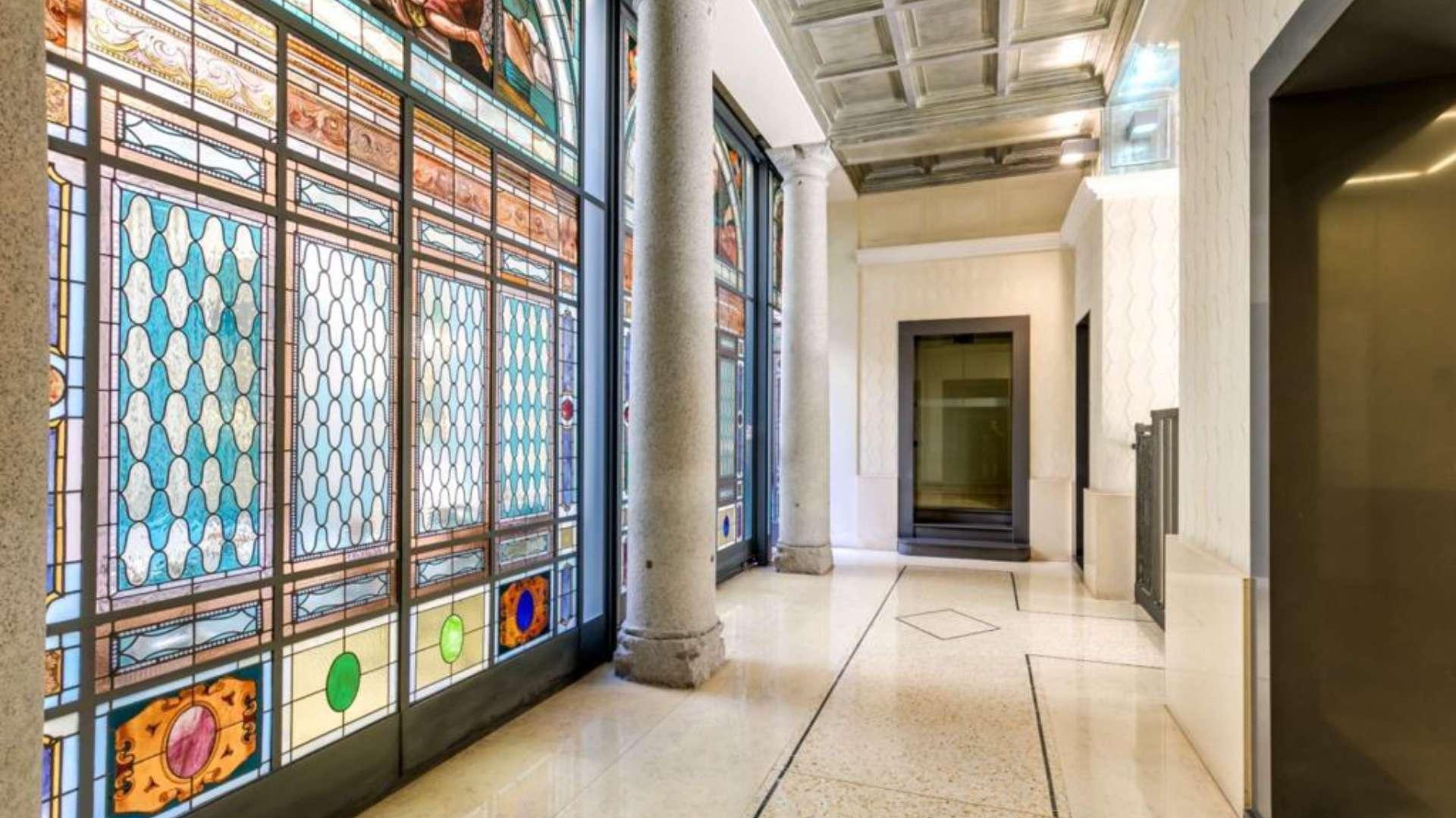 Courtyard view of fully renovated loft near Castello Sforzesco, Milan with bicycles