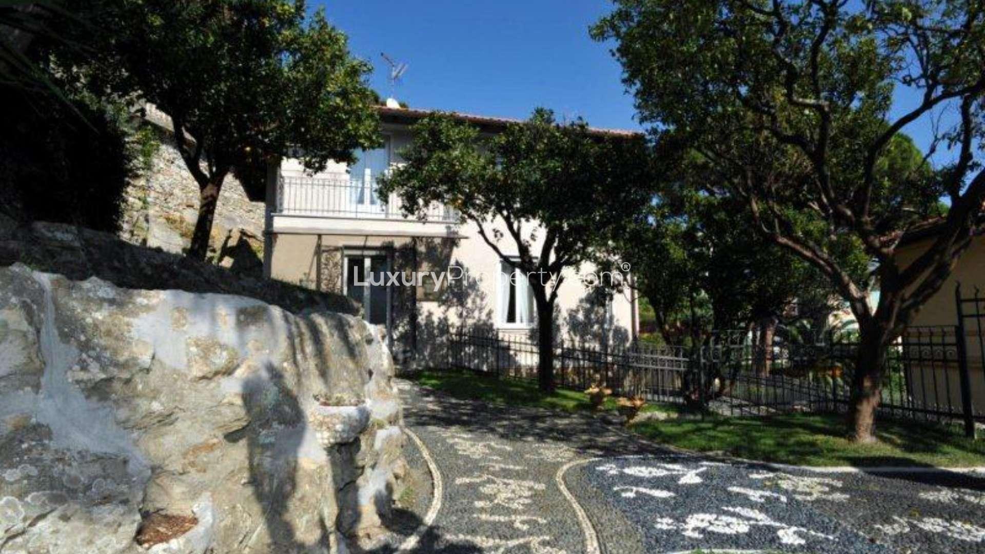 Elegant staircase in luxury villa, Santa Margherita Ligure, featuring wrought iron railings