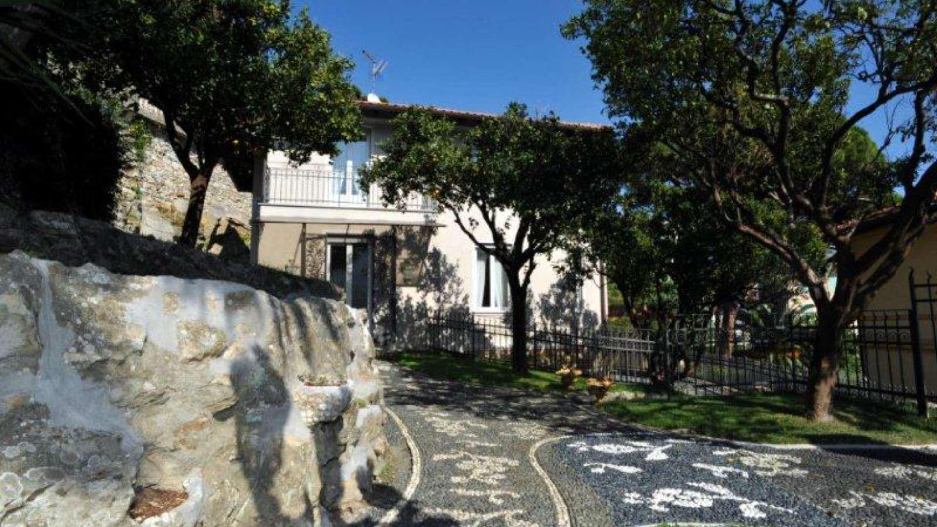 Elegant staircase in luxury villa, Santa Margherita Ligure, featuring wrought iron railings