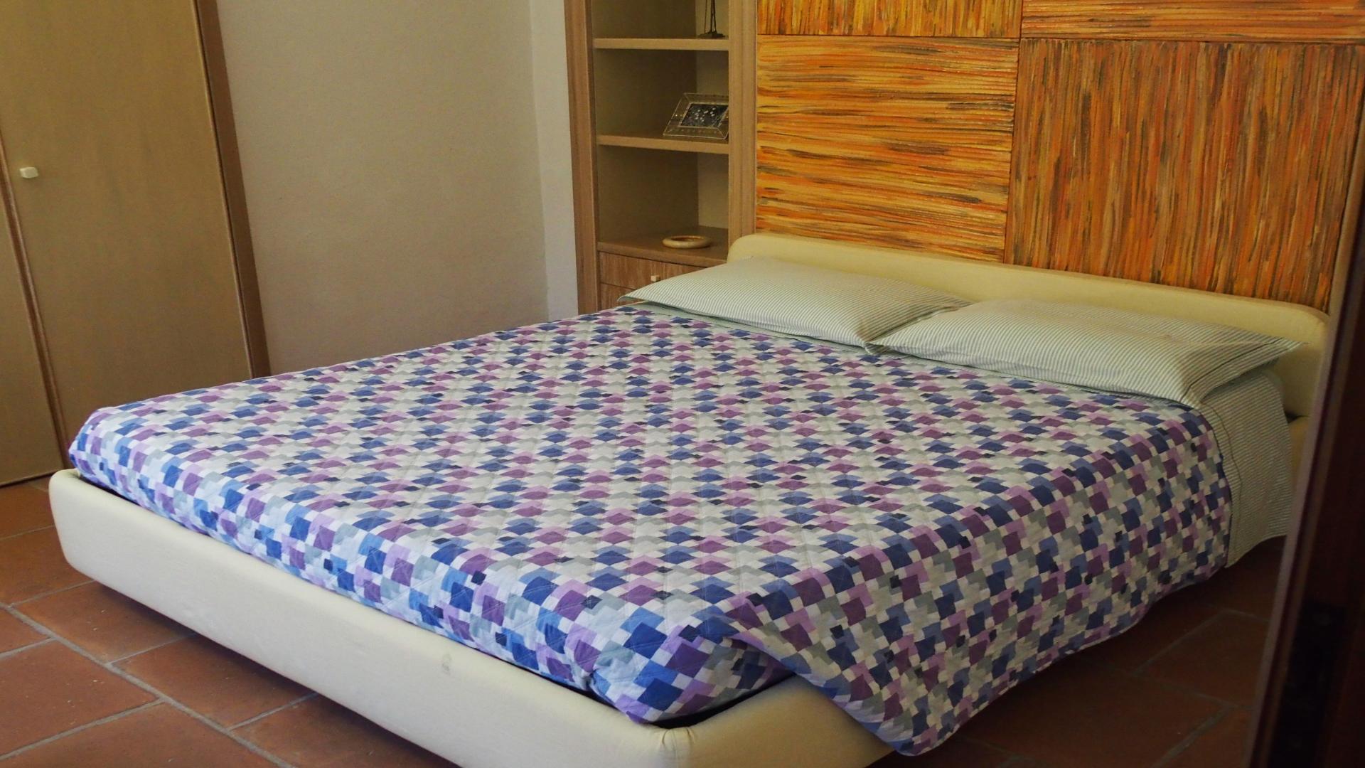 Elegant Art Nouveau villa entrance with columns and blooming garden in Vigevano, Pavia Province