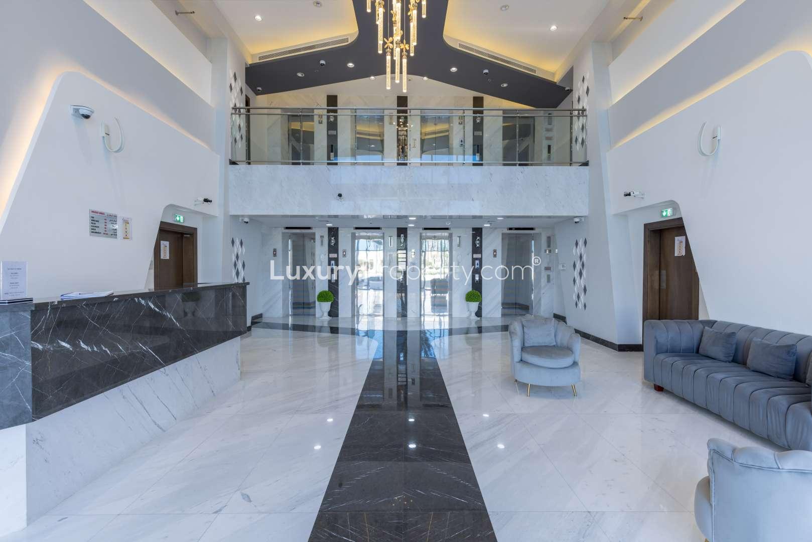 Luxurious lobby in commercial building for sale, Al Furjan, Dubai, modern design, spacious area