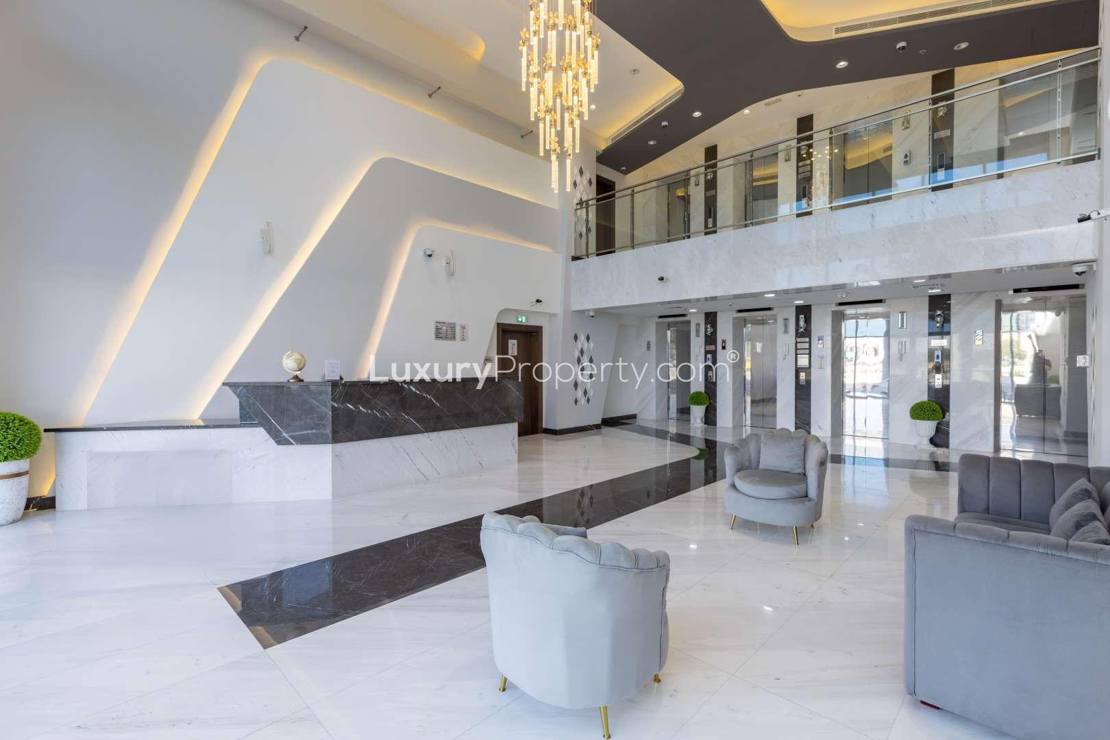 Commercial building courtyard in Al Furjan, Dubai, featuring landscaped gardens and modern architecture