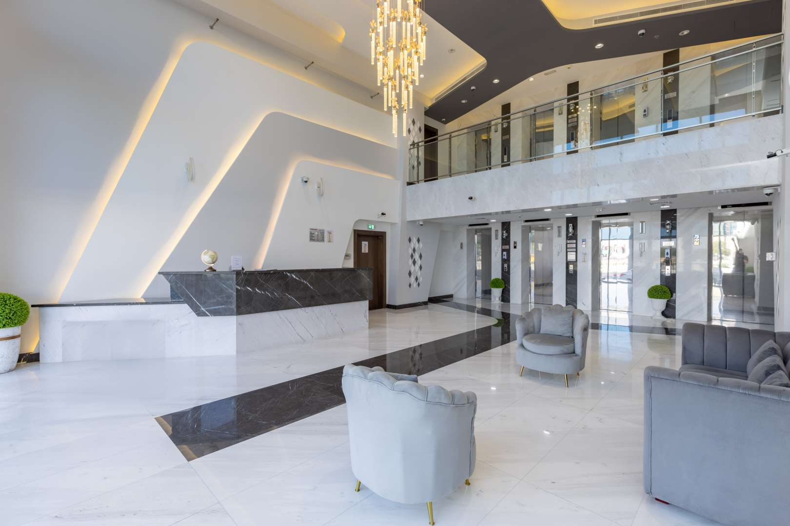 Commercial building courtyard in Al Furjan, Dubai, featuring landscaped gardens and modern architecture