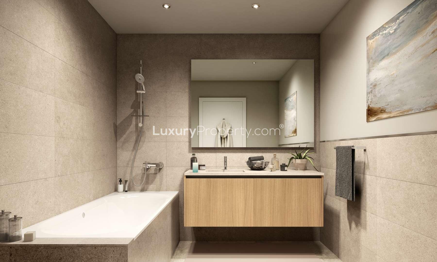 Modern gym in Bayshore Apartments, Dubai Creek Harbour with exercise equipment and natural light