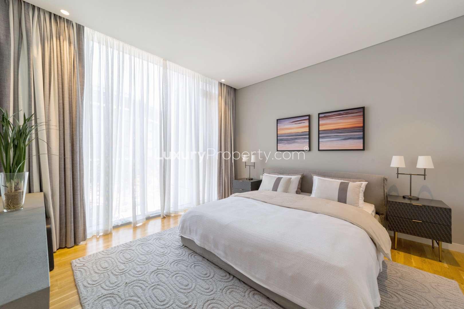 Modern dining area in Bluewaters apartment with elegant decor and open kitchen