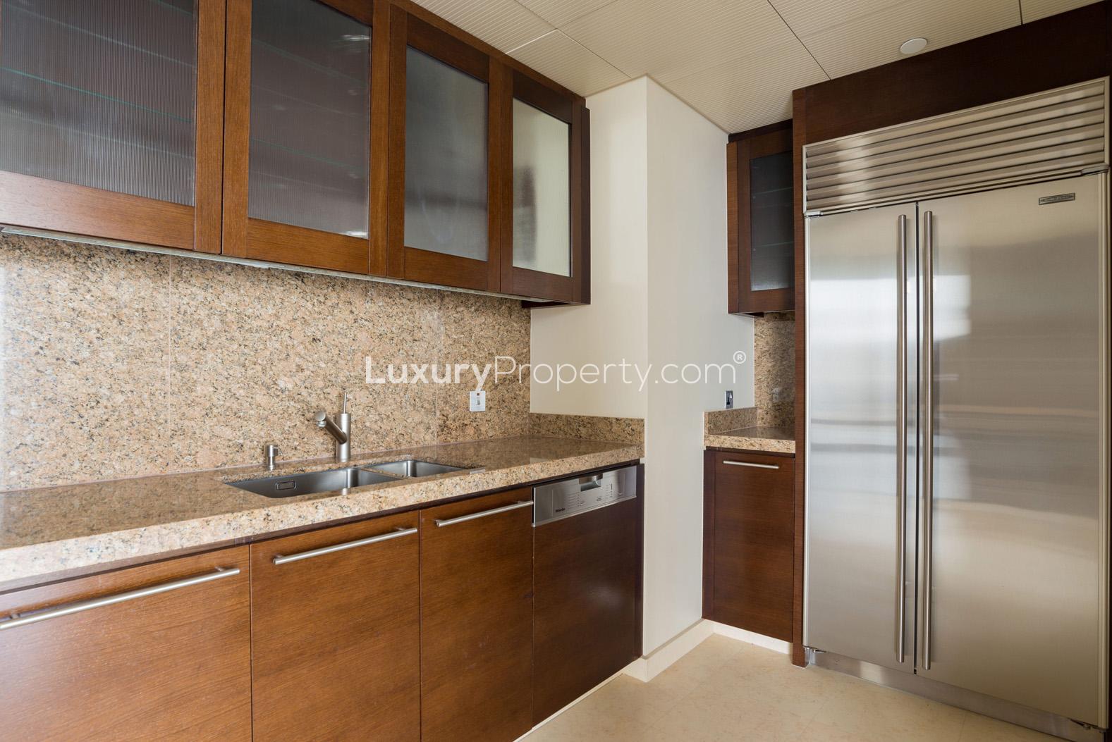 Contemporary kitchen in studio apartment at Burj Khalifa, Downtown Dubai, featuring modern appliances