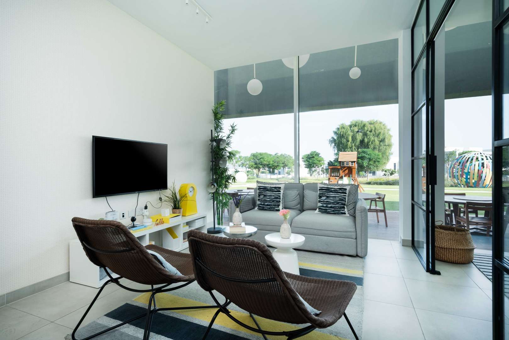 Modern kitchen in studio apartment, Dubai Hills Estate, with stylish decor and dining table