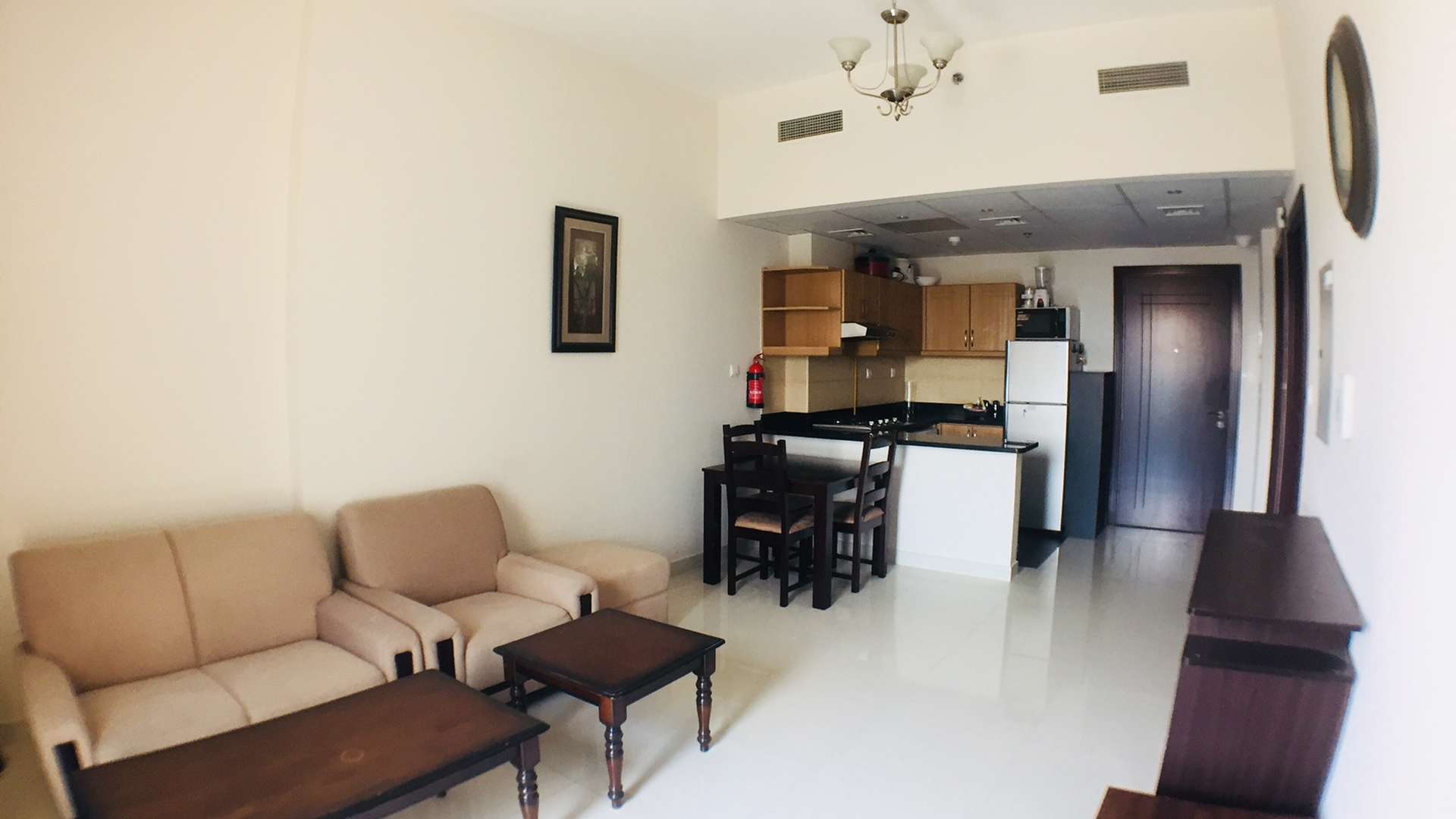 Studio bedroom with large window in Elite Sports Residence, Dubai Sports City apartment