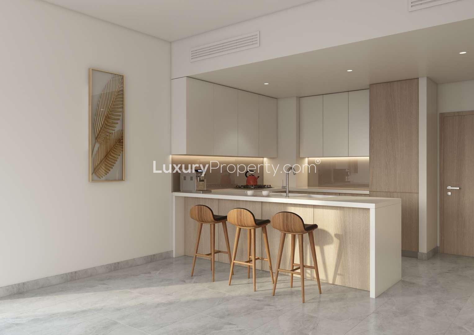 Waterfront apartment view in Business Bay, Dubai, showcasing vibrant night cityscape and marina