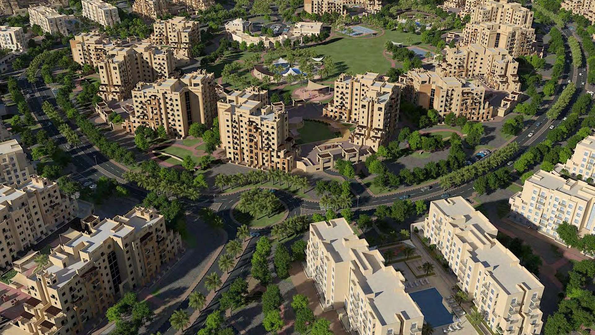 Modern apartment building in Remraam, Dubailand, featuring multiple balconies and lush landscaping
