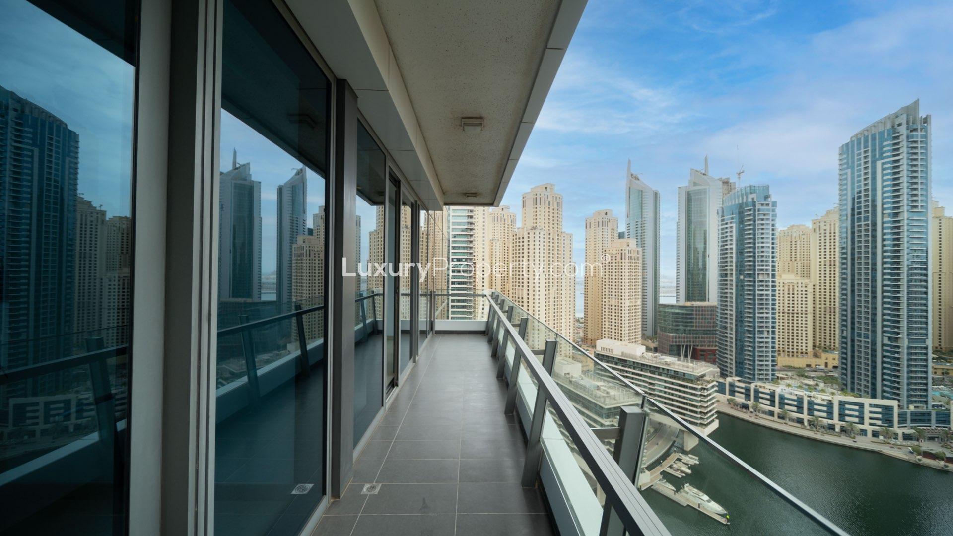 Bright living area with large windows in Dubai Marina apartment for rent