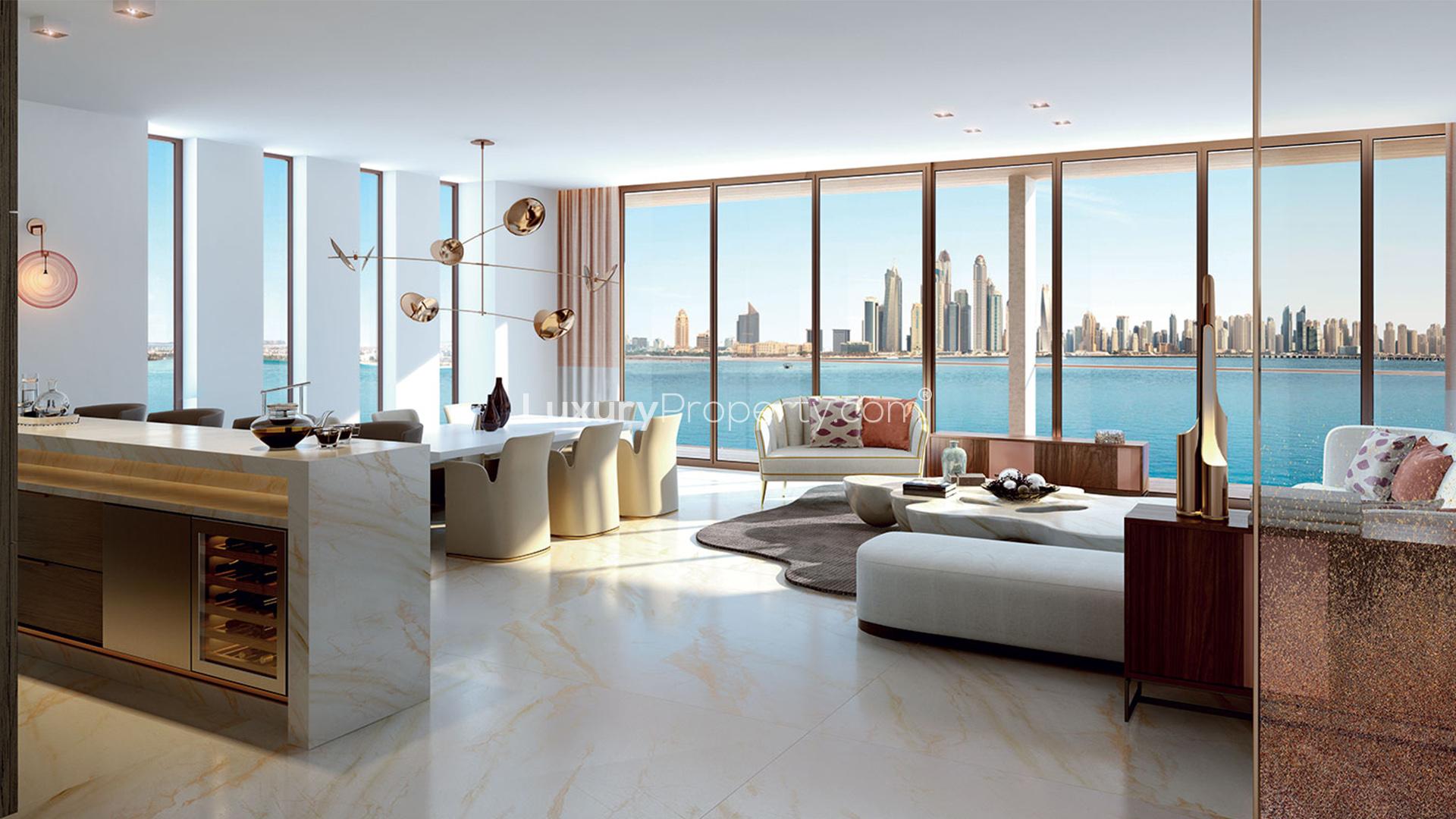 "Luxurious Garden Suite Townhouse at Atlantis The Royal, Palm Jumeirah, overlooking stunning skyline.",Luxurious living room with sea view in Palm Jumeirah townhouse, Atlantis The Royal Residences
