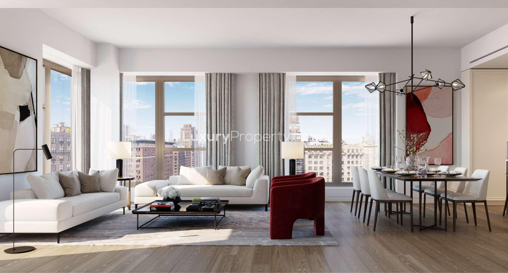 Luxury living room in four-bed Manhattan apartment with fireplace and city views