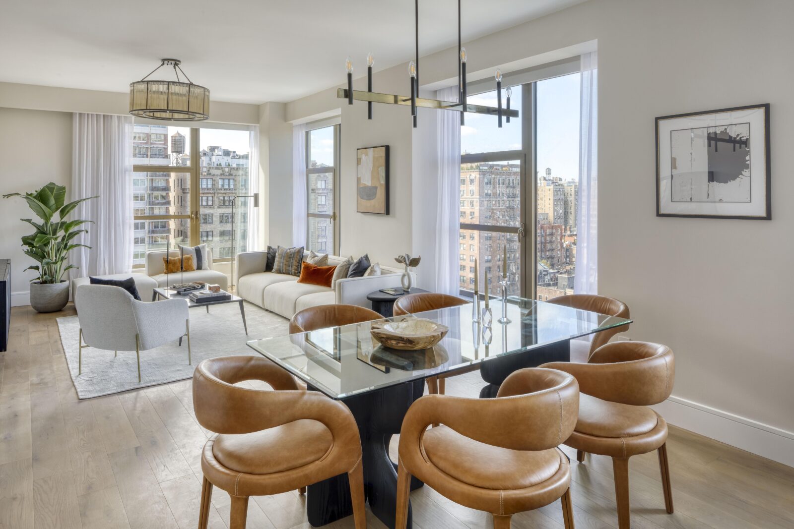 Elegant bedroom in three-bedroom Manhattan apartment, featuring stylish decor and natural light