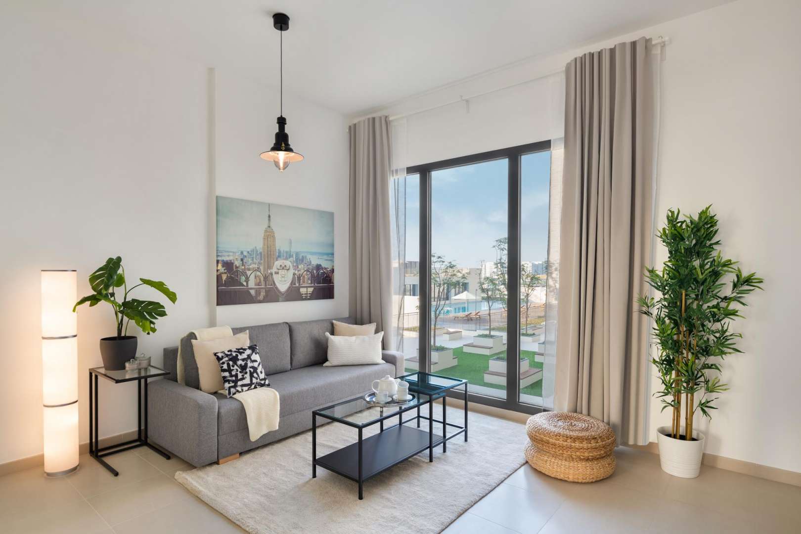 N/A,Stylish living room in UNA, Dubai Town Square apartment with modern decor and large window