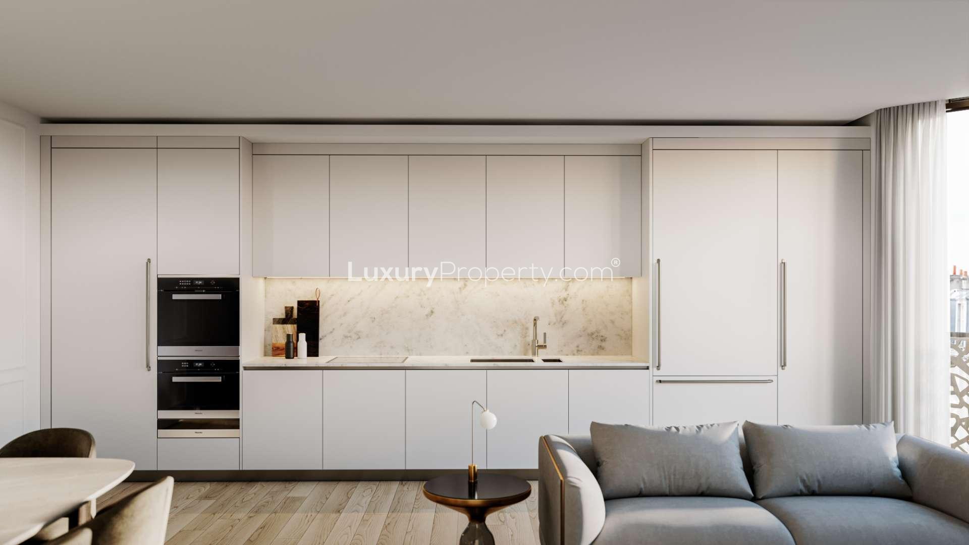 N/A,Modern kitchen in W1 Place apartment, featuring sleek cabinetry and large windows in London