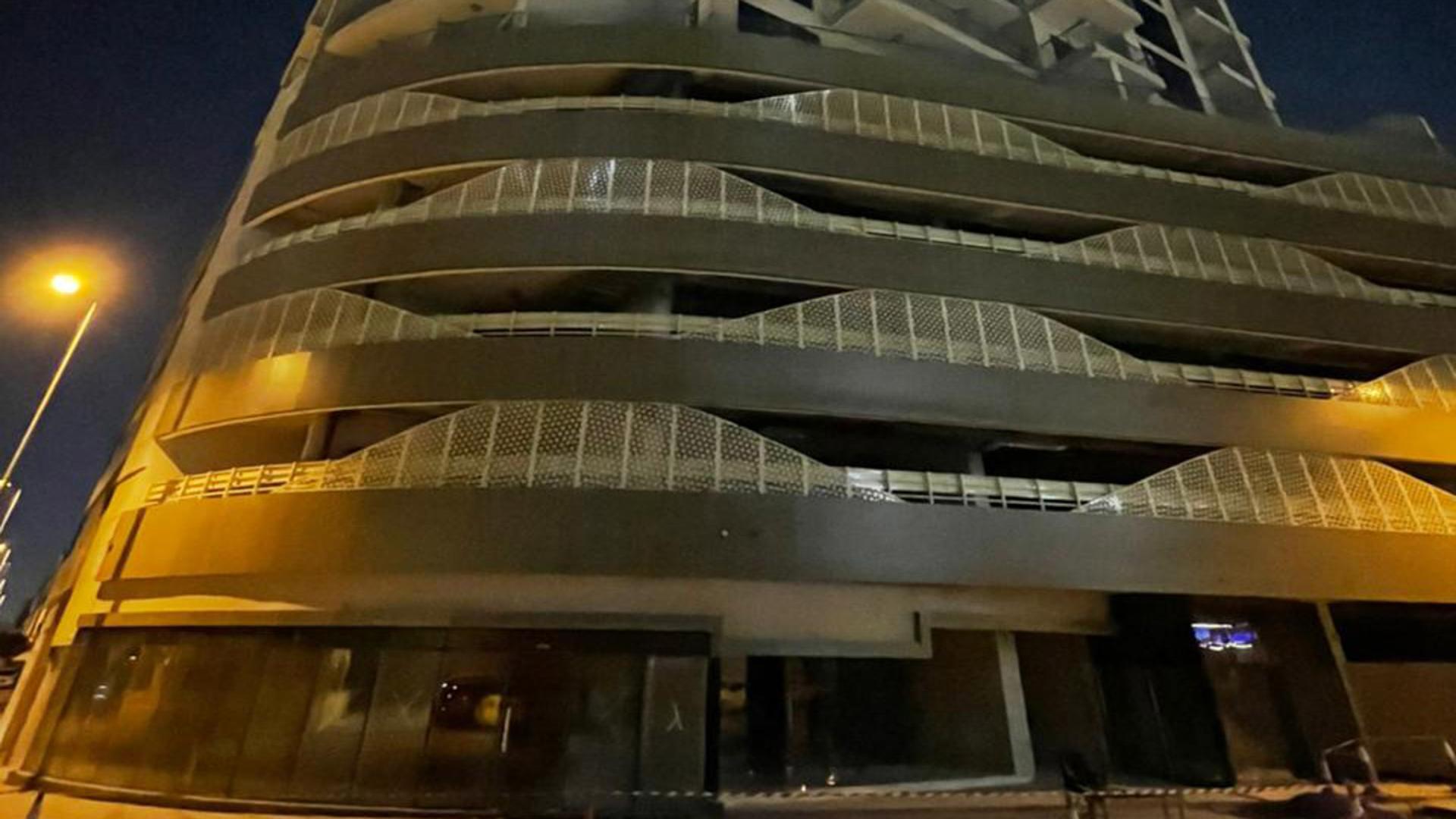 N/A,Night view of premium residential building exterior in JVC, Dubai, for sale