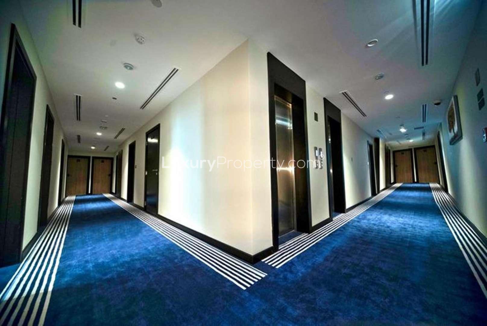 Alt text: "Exterior view of brand new 3-star hotel for sale, modern architecture, investment opportunity.",Brand New 3-Star Hotel Corridor with Elevators, Investment Opportunity for Sale