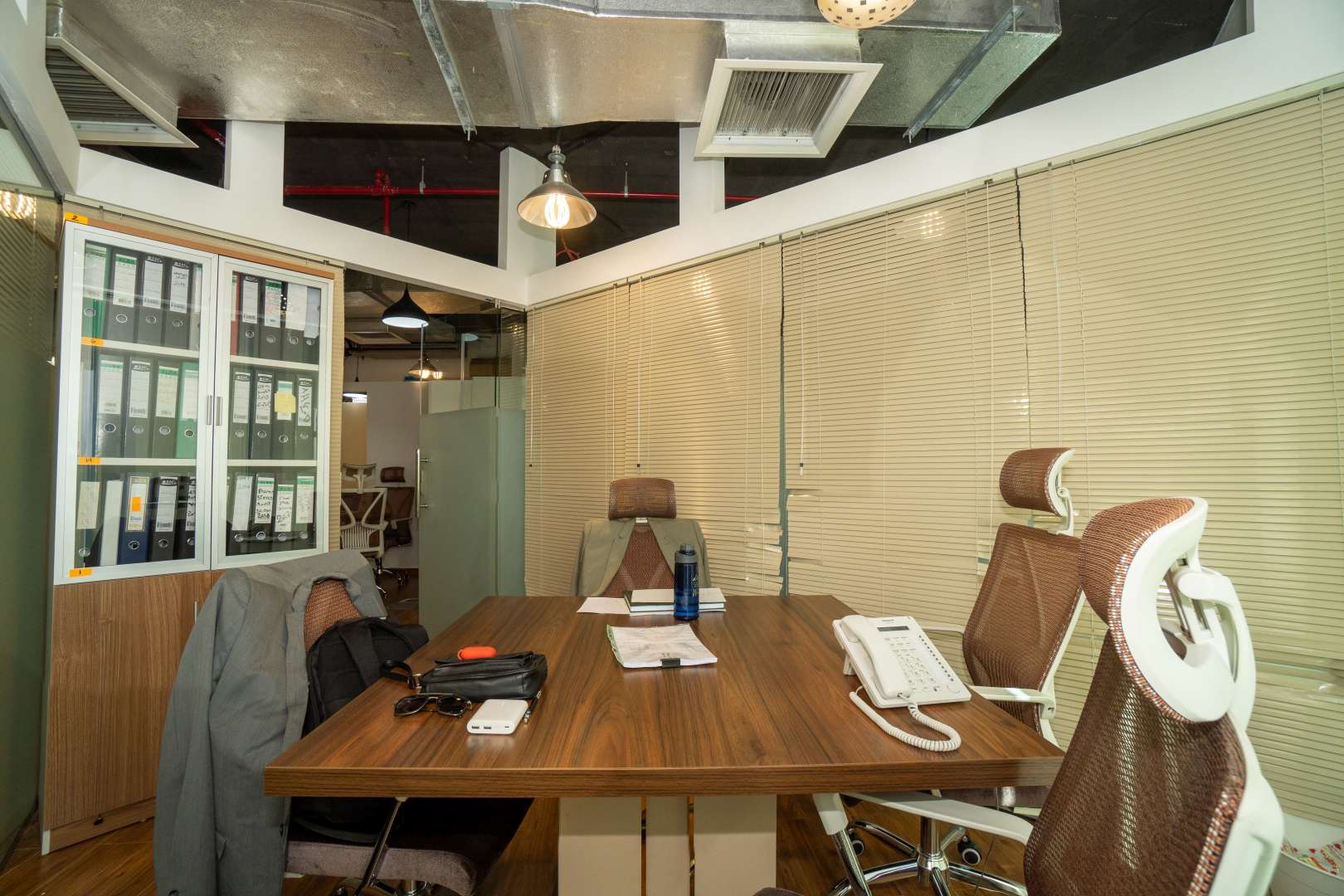 Modern office interior in XL Tower, Business Bay, featuring ergonomic chairs and wooden flooring