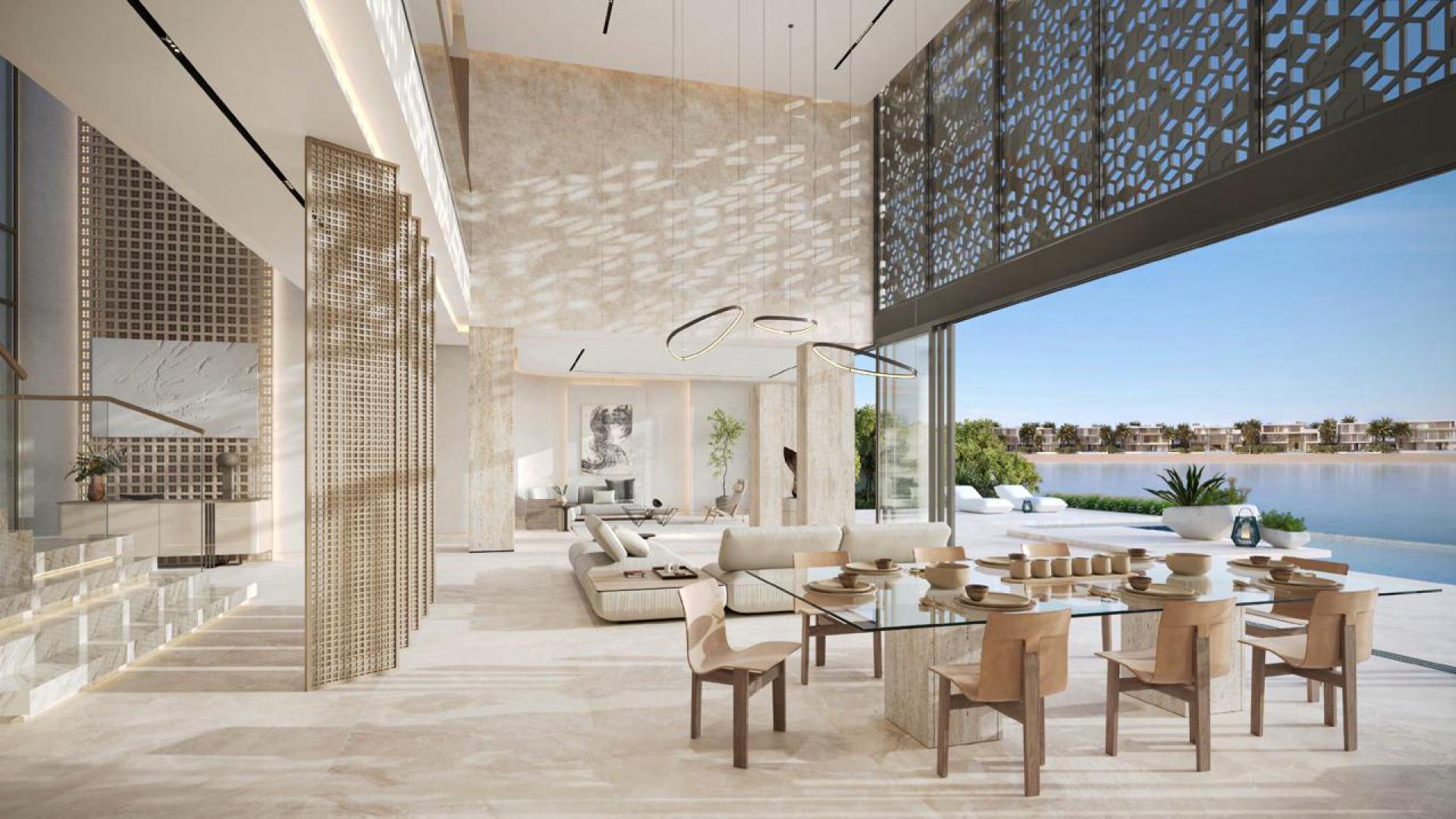 Luxury beachfront view from Palm Jebel Ali land plot with pool and seating area