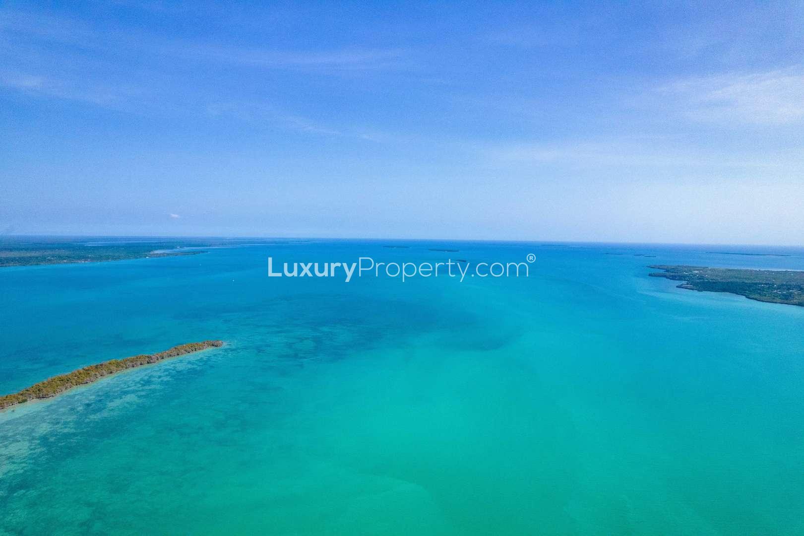 Aerial view of private island for sale in Zanzibar, Kiwani Bay, turquoise waters