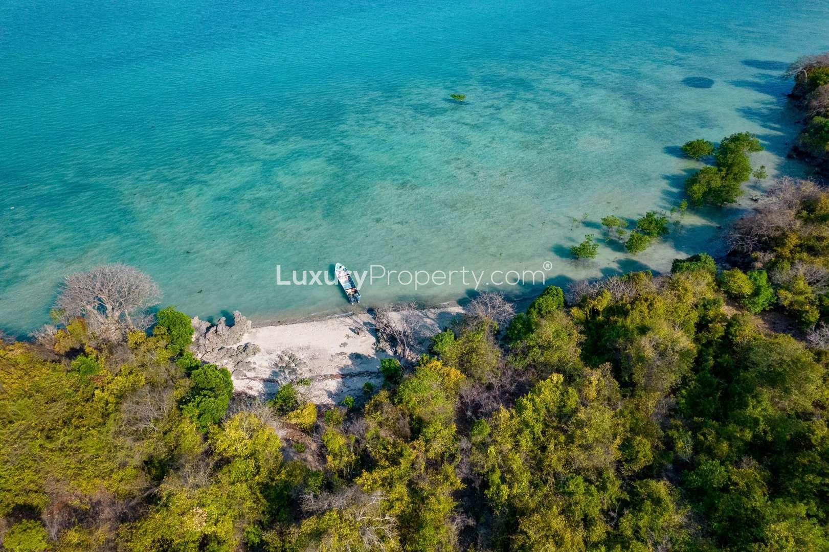 Aerial view of private island for sale in Zanzibar, Kiwani Bay, with lush greenery
