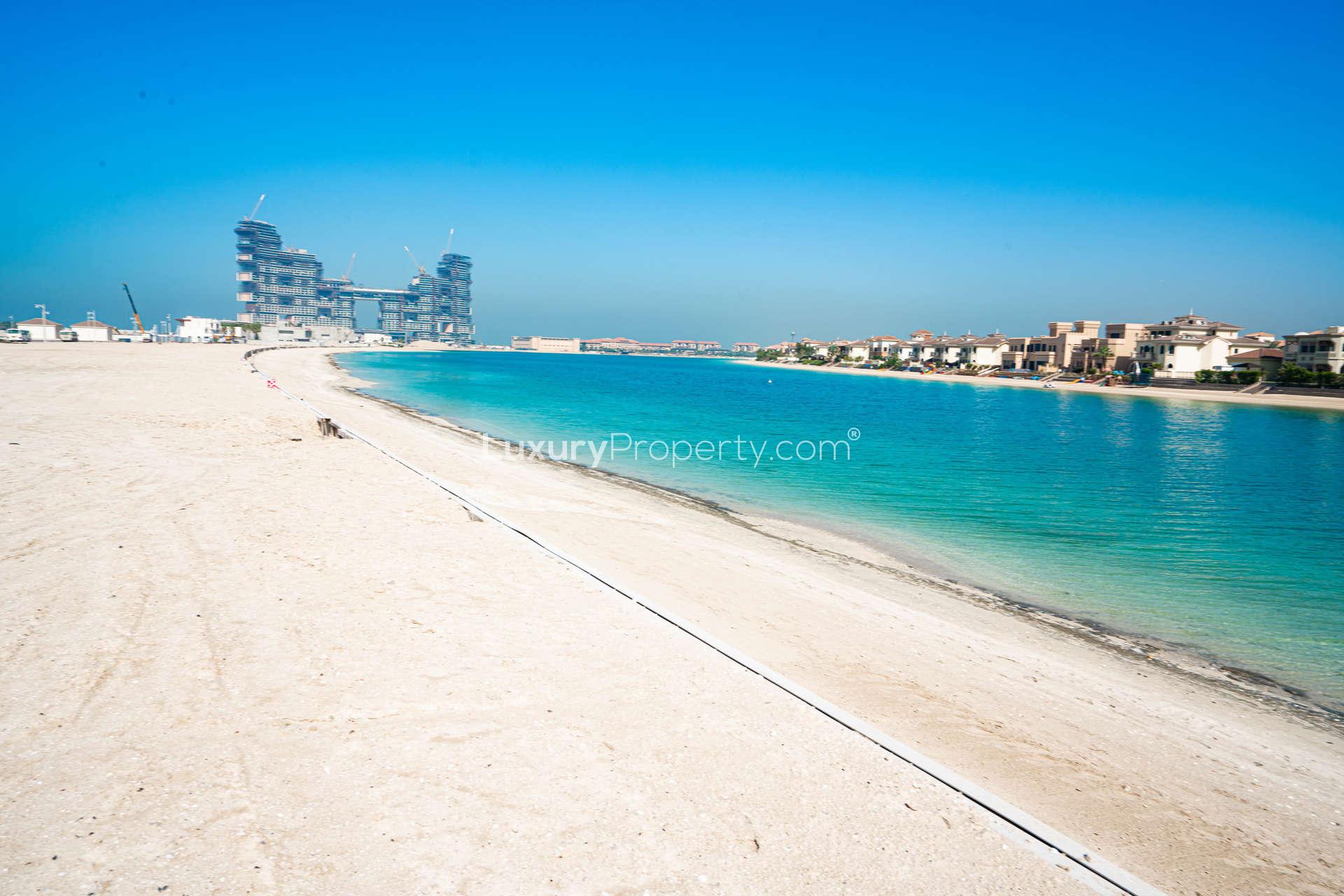 Beachfront plot for sale on Palm Jumeirah, offering stunning views of clear blue waters