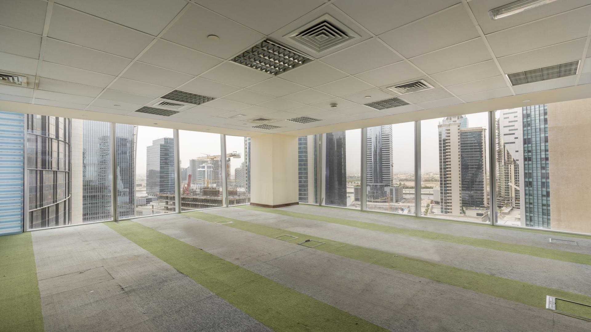 Exterior view of premium tower in Business Bay with modern architecture and water features