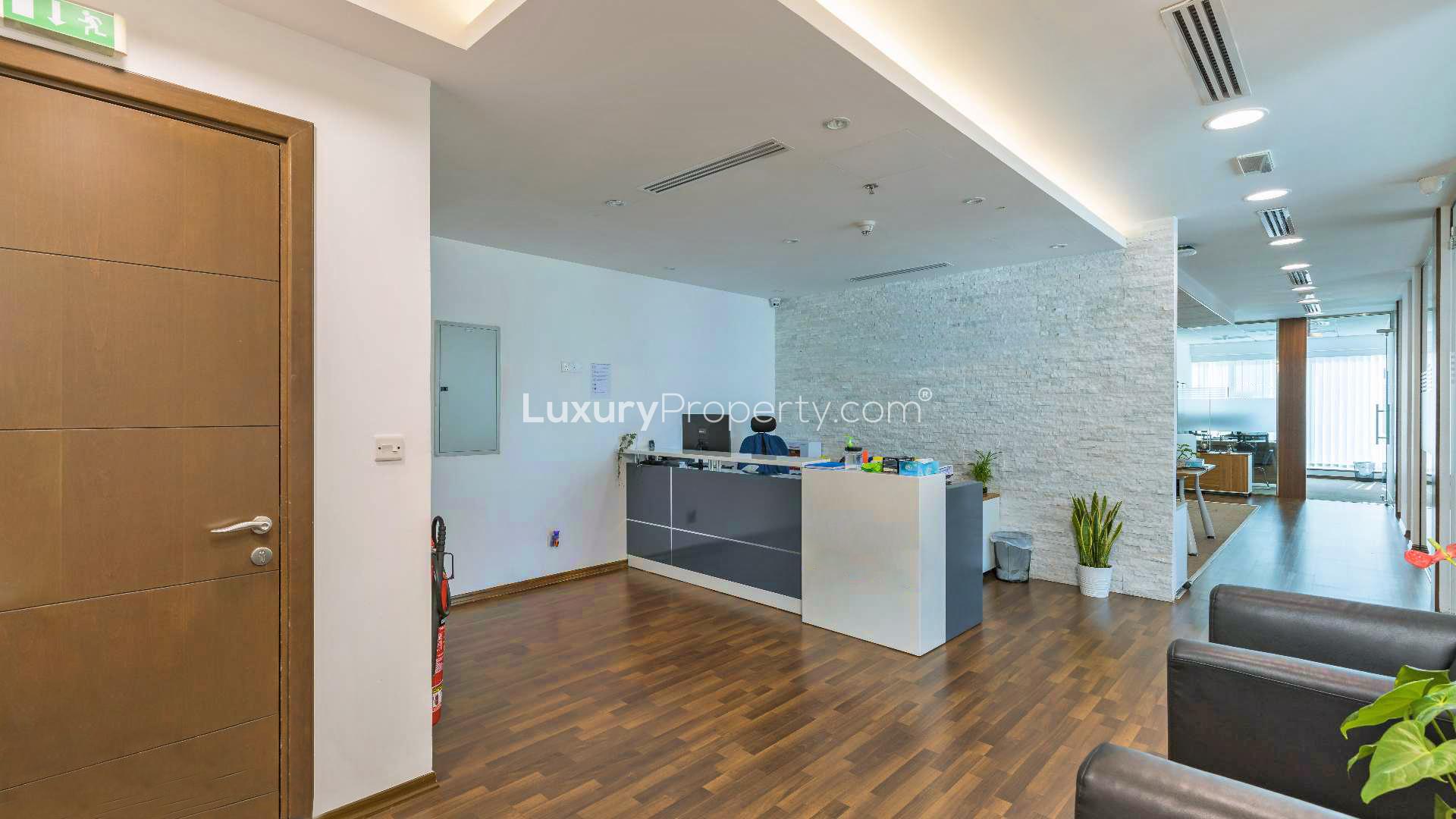 Modern office reception in Burlington Tower, Business Bay, with sleek design and glass partitions