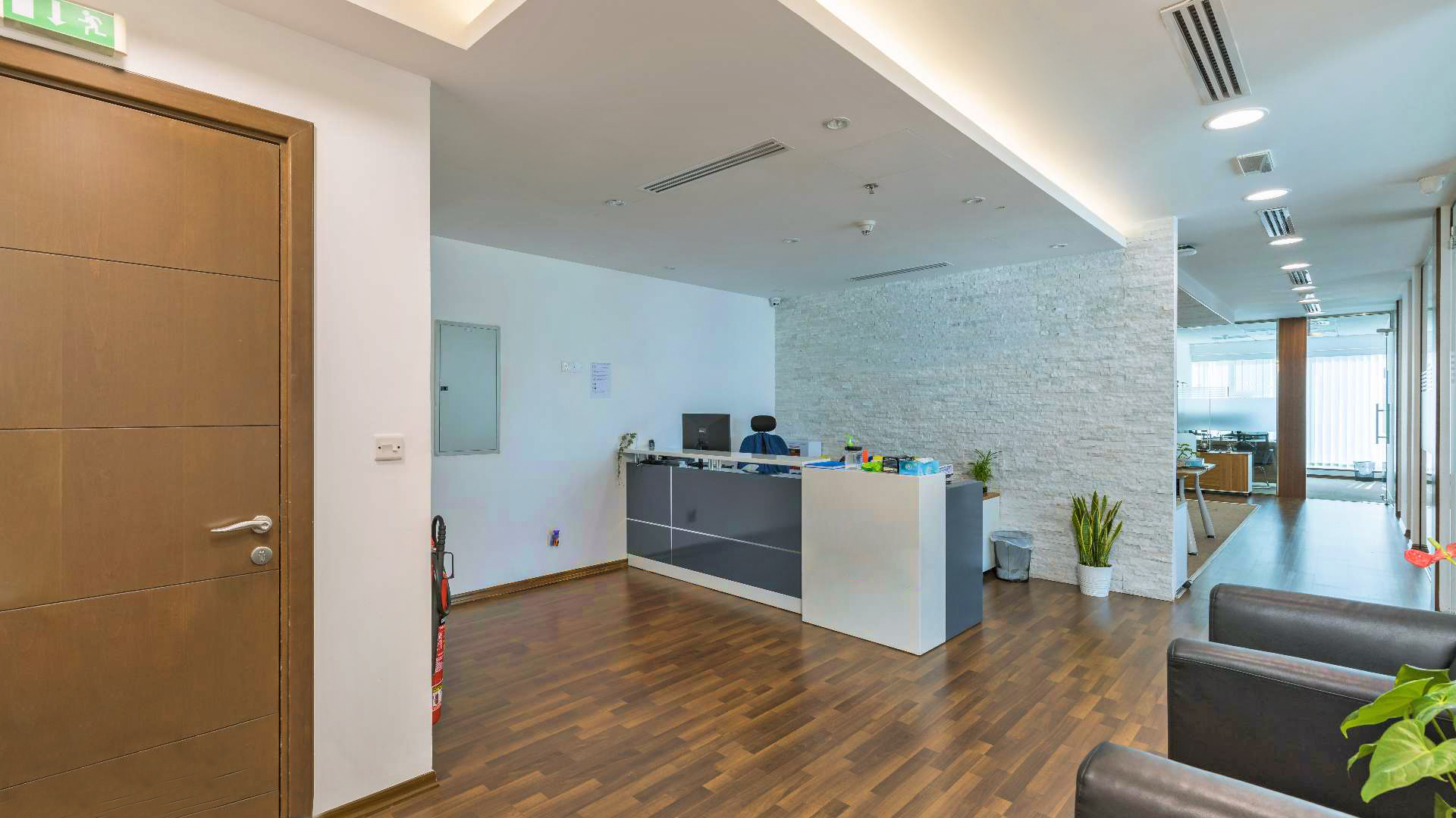 Modern office reception in Burlington Tower, Business Bay, with sleek design and glass partitions