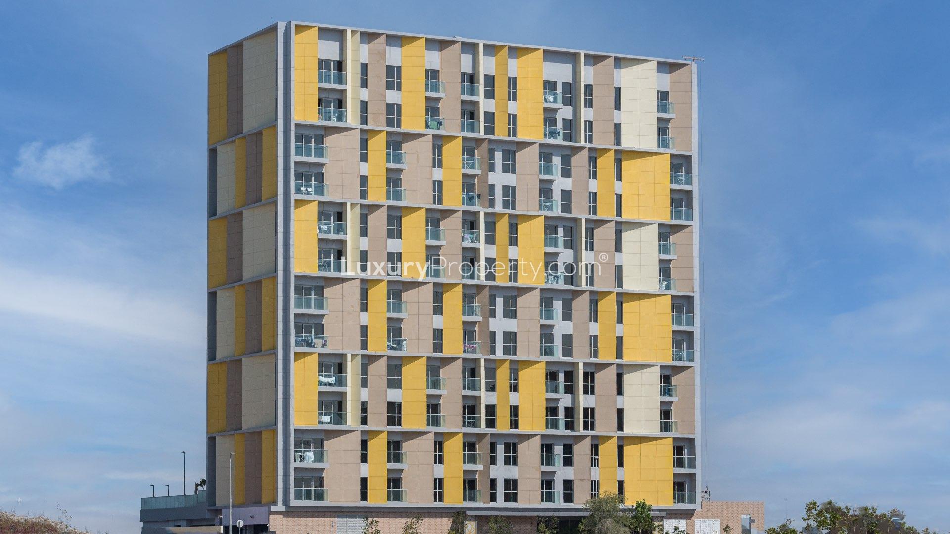 "Full apartment building in Arjan's Priva Living community, 130 studio units for sale.",Modern gym in Priva Living apartment building, Arjan community, fully equipped with exercise machines