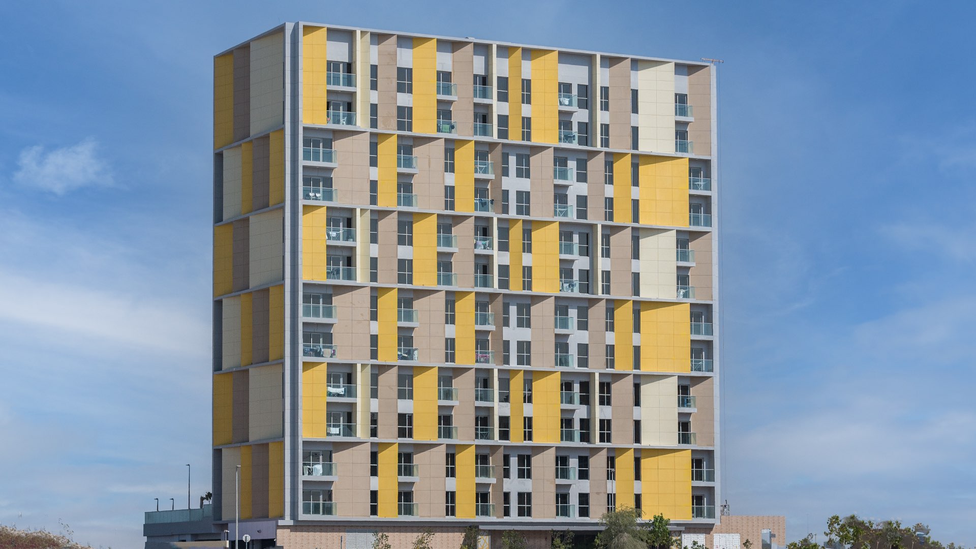 "Full apartment building in Arjan's Priva Living community, 130 studio units for sale.",Modern gym in Priva Living apartment building, Arjan community, fully equipped with exercise machines