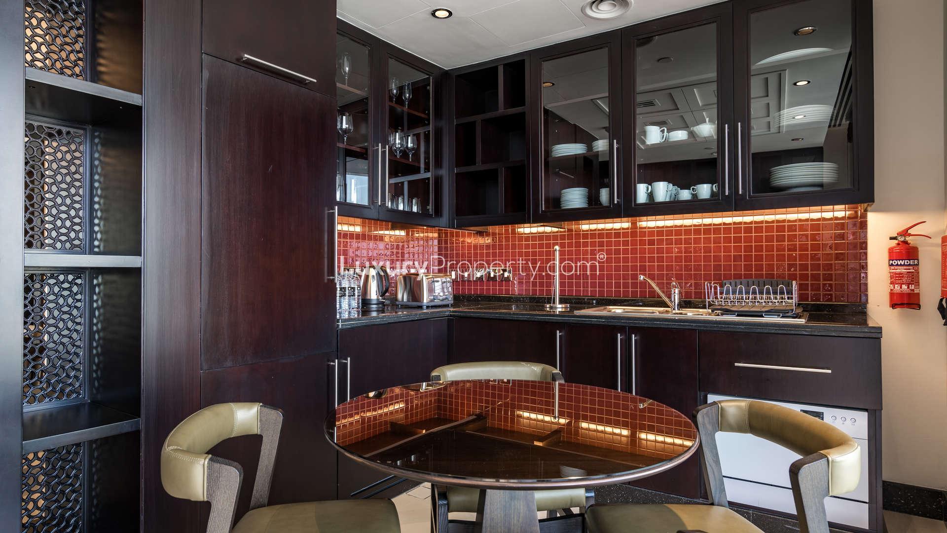 Dining area in one-bedroom apartment, Burj Lake Hotel, Downtown Dubai, modern decor, large window