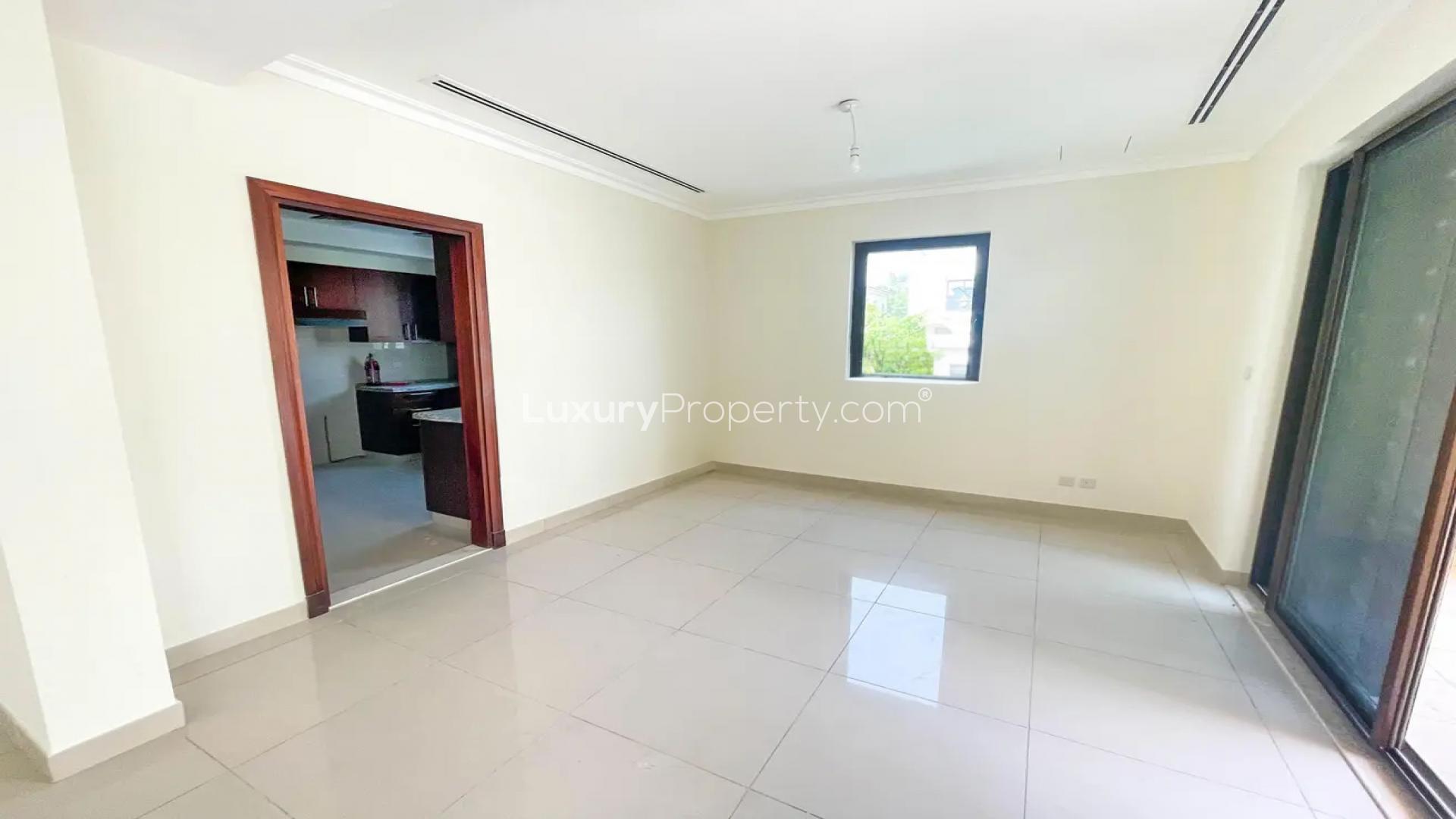 Spacious backyard with lush lawn and pathway in Samara townhouse, Arabian Ranches 2