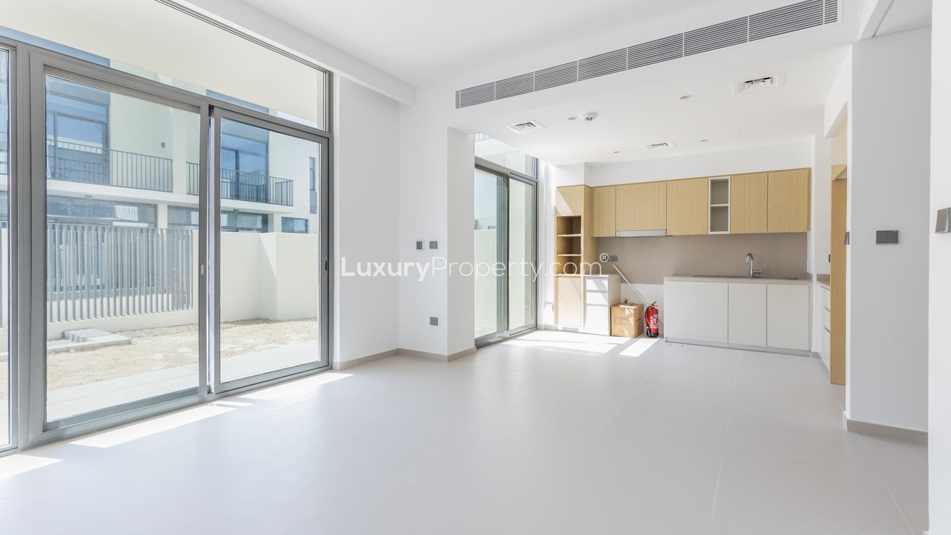 Contemporary townhouse exterior in Joy, Arabian Ranches III, featuring modern architecture and spacious garages