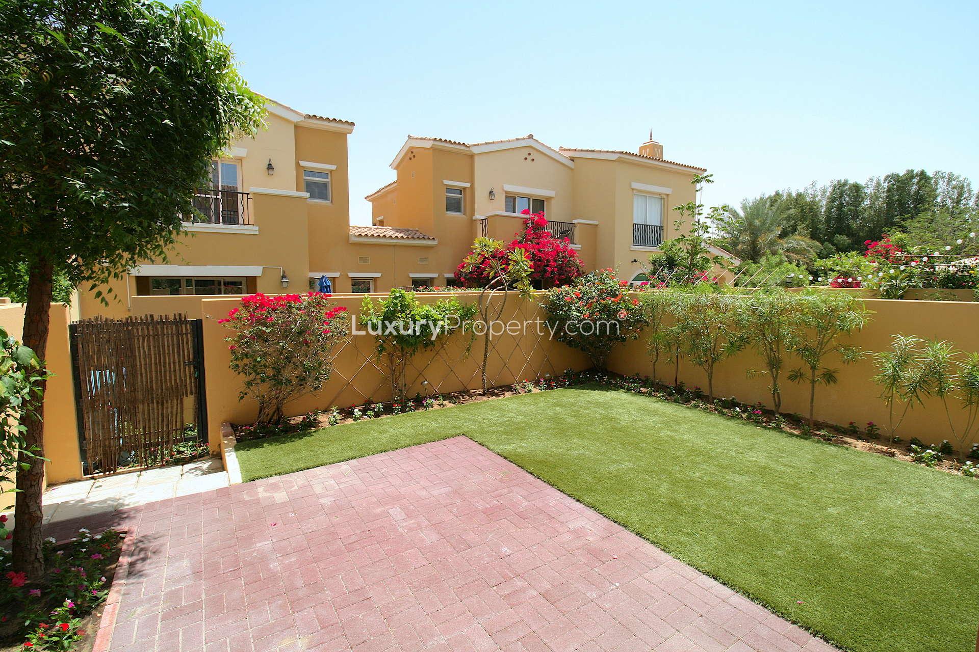 Spacious living area in upgraded 2-bedroom townhouse, Palmera, Arabian Ranches, wood flooring, bright windows