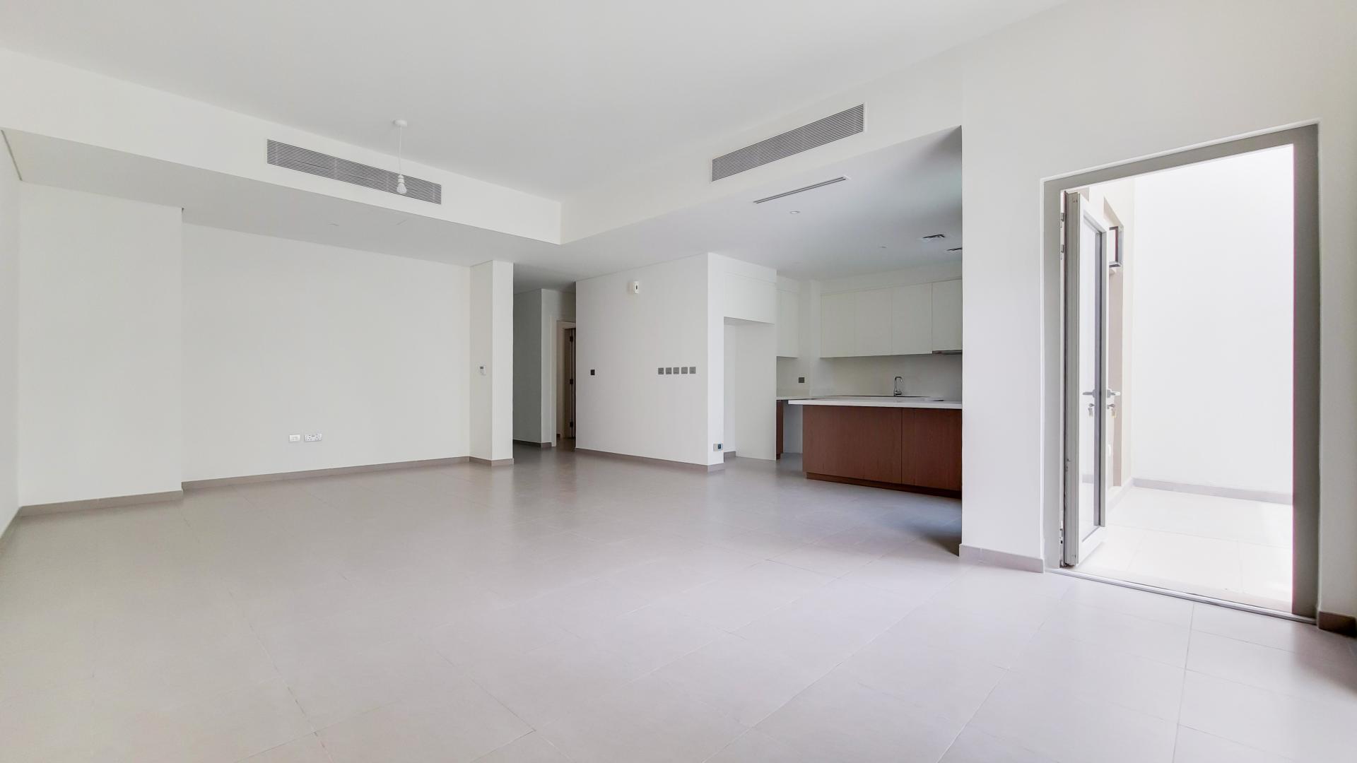 Open-plan kitchen and living area in Reem townhouse, Arabian Ranches 2, Dubai