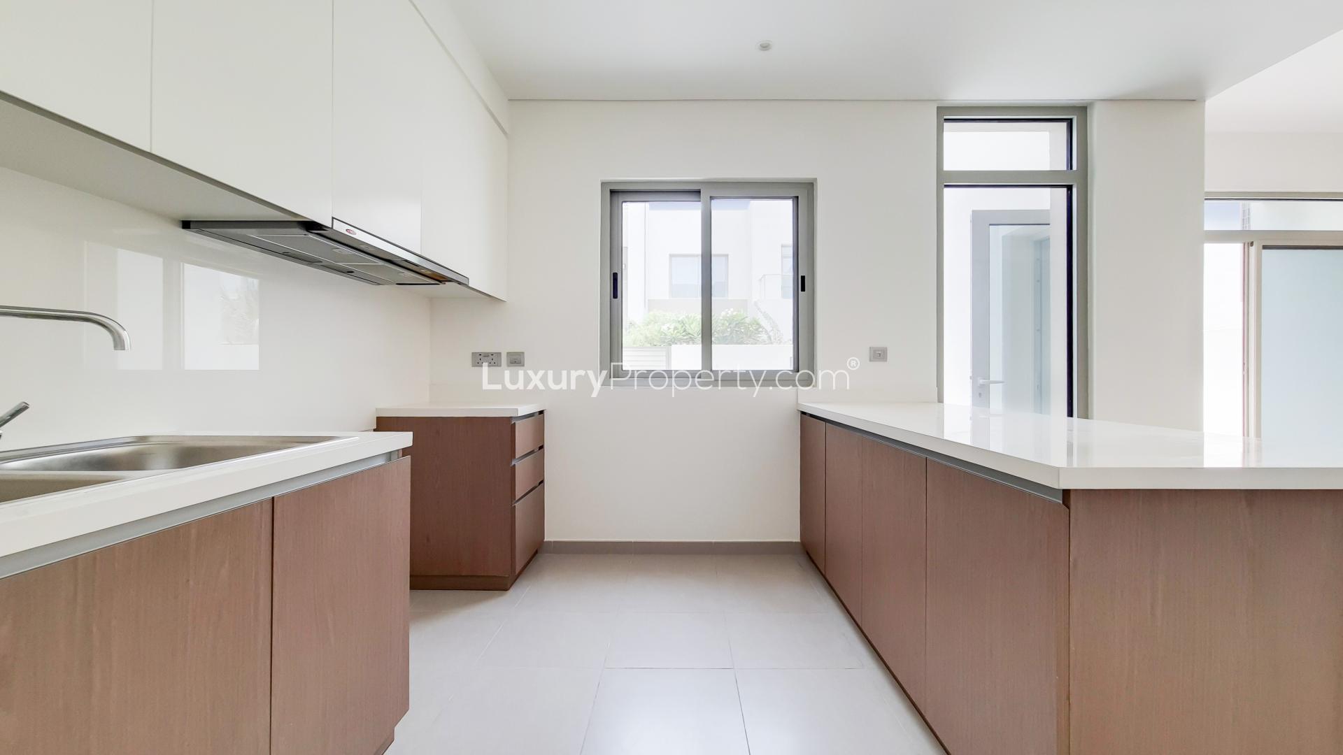 Modern kitchen in 3-bedroom townhouse, Reem Community, Arabian Ranches 2, Dubai. Bright and spacious
