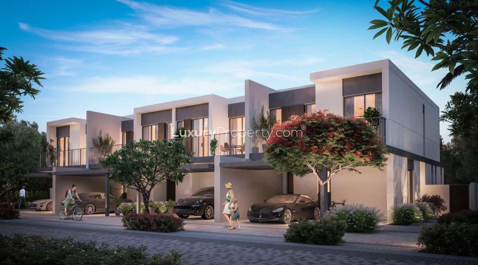 Modern three-bedroom townhouse in Elan, Tilal Al Ghaf, with lush greenery and parking