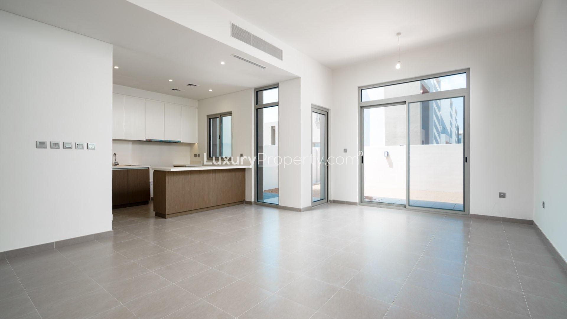 Modern 3-bedroom townhouse exterior in Reem Community, Arabian Ranches 2, for sale