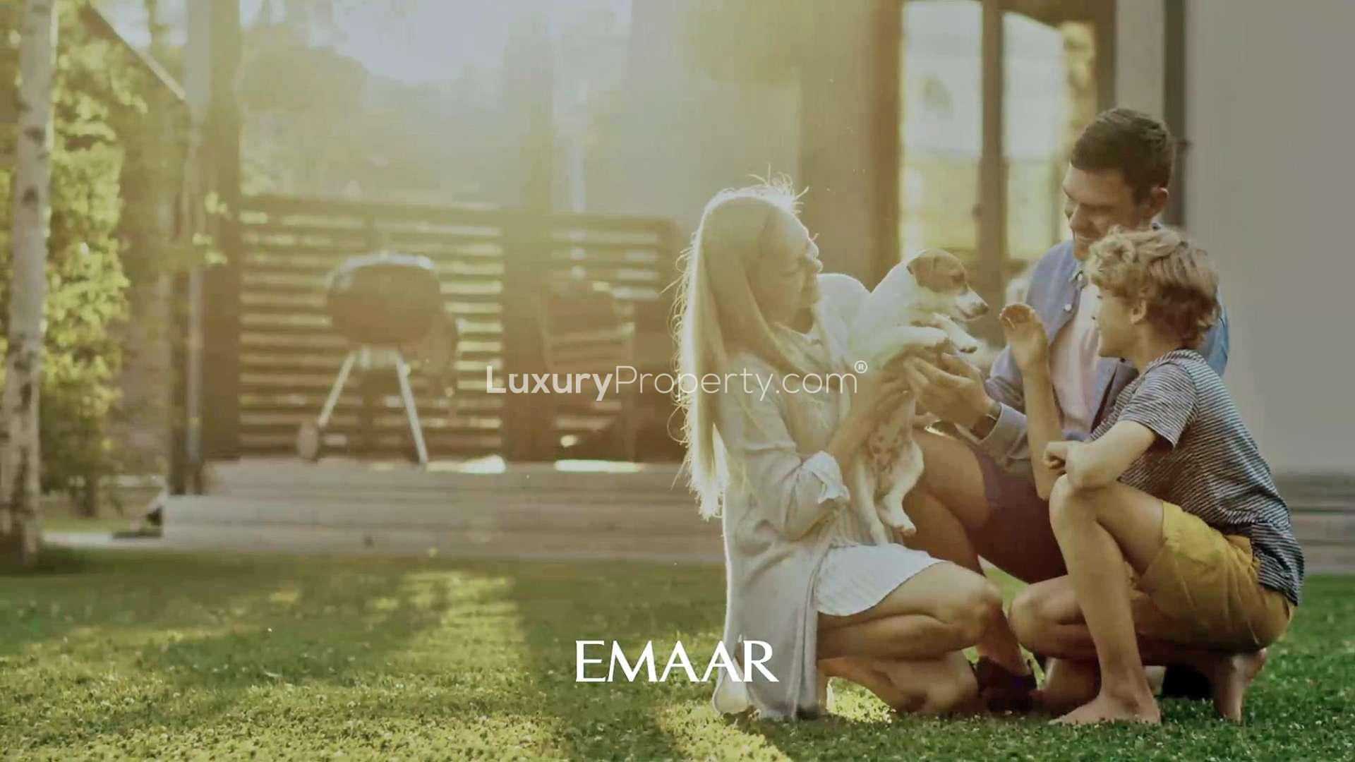 Family enjoying backyard at Dubai Creek Harbour townhouse by Emaar, pet-friendly environment